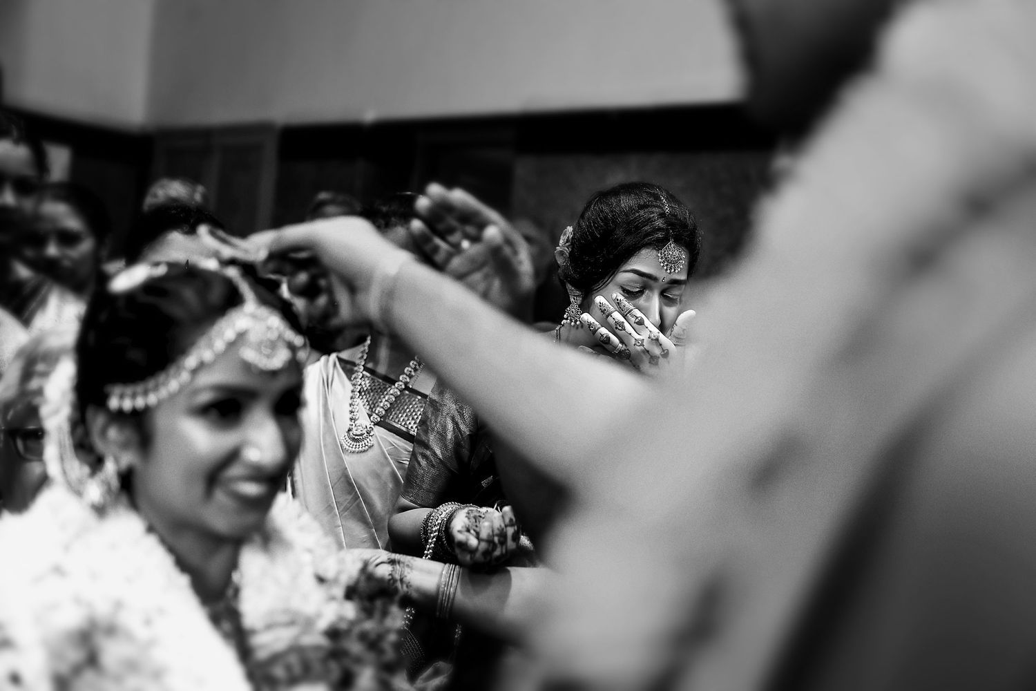 Black and white candid celebration moment through creative framing.