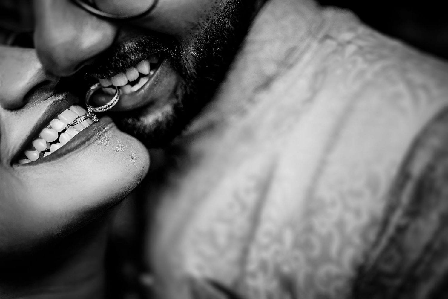 Black and white portrait photography series showing close-up smiling expressions and emotional moments.