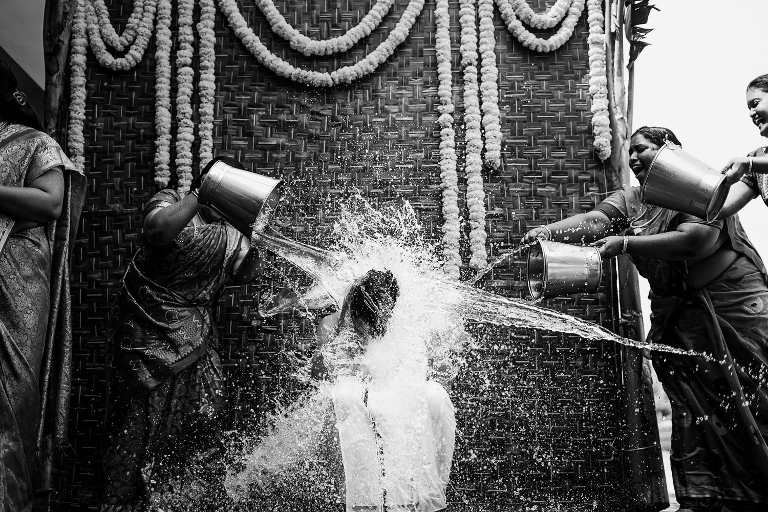 Documentary style sequence of water splashing against brick wall.
