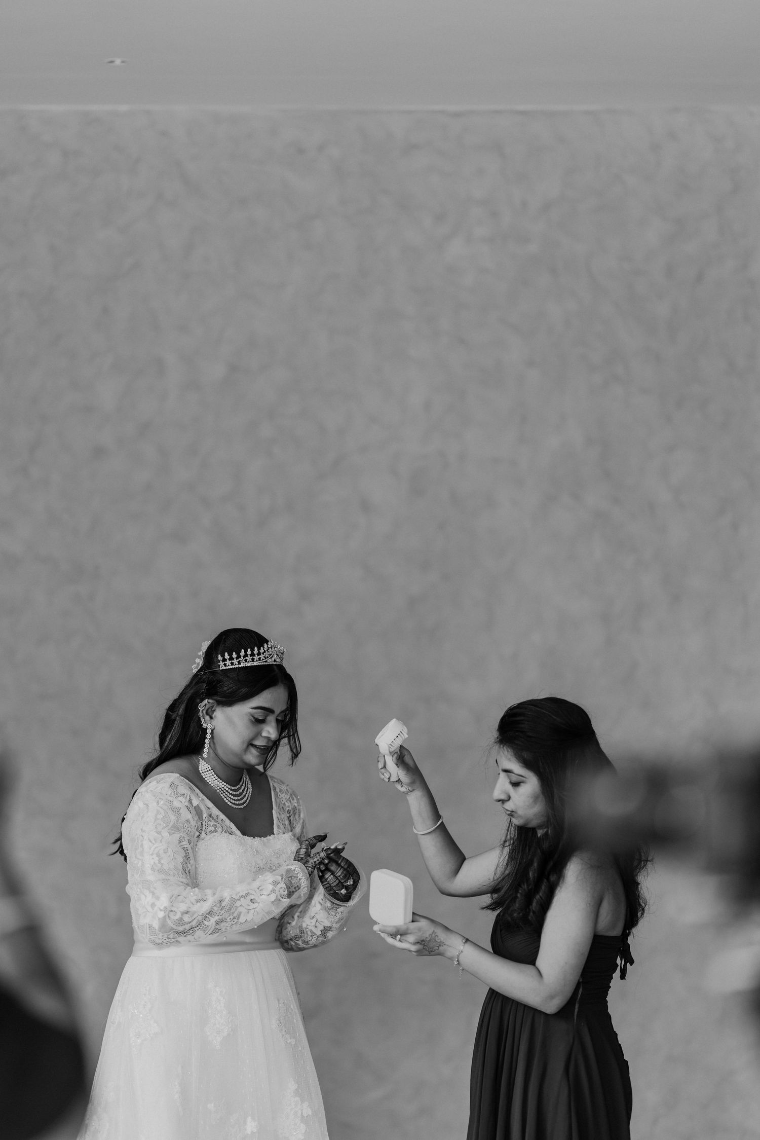 Black and white sequence showing playful interactions between two figures in formal attire.