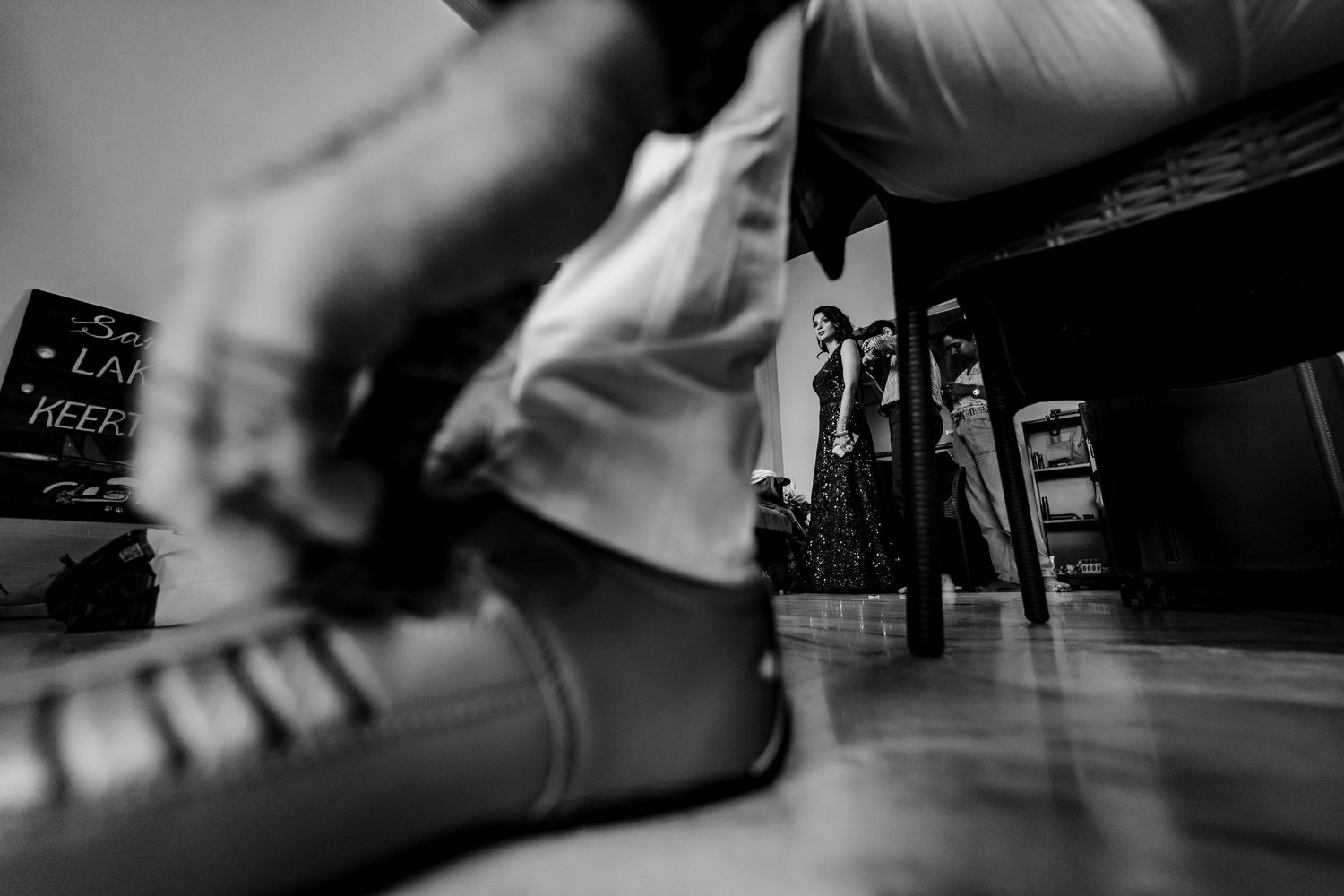A blurred motion sequence of black and white photographs showing movement in an urban setting.