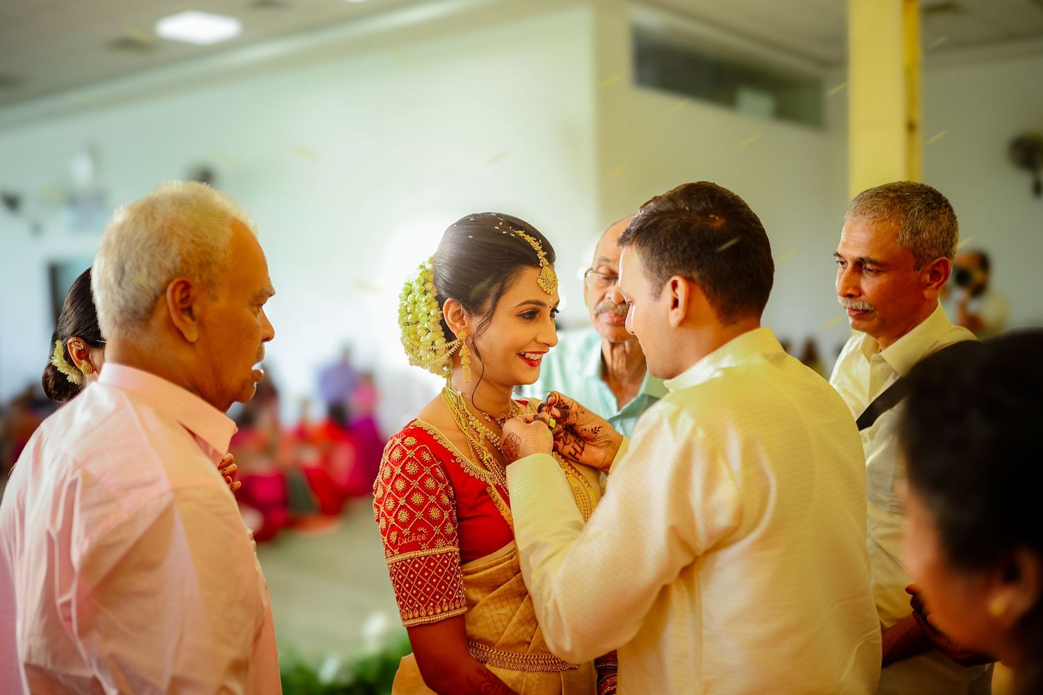 Wedding guests dance and celebrate together during a joyful reception celebration.