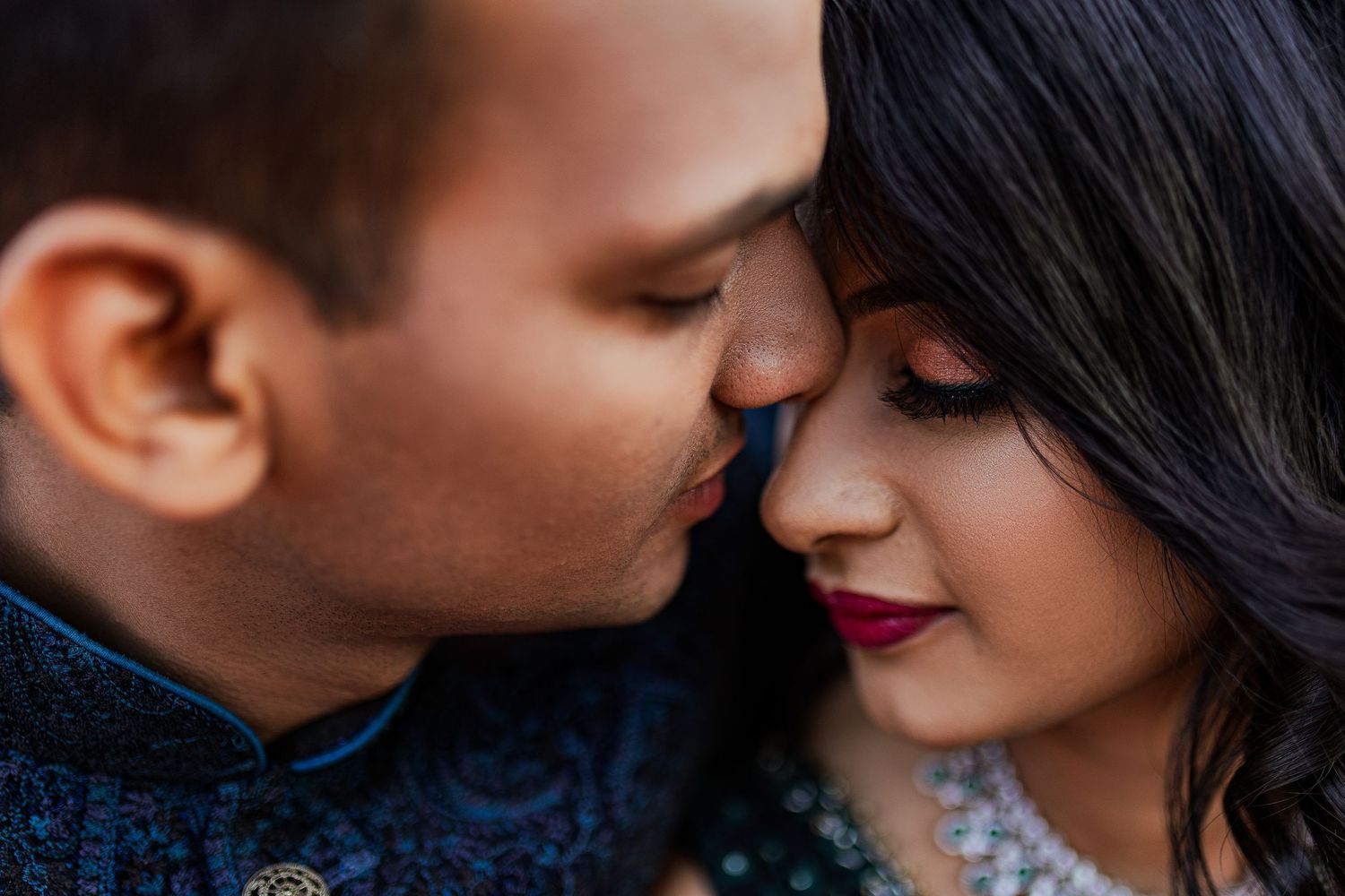 Romantic couple in formal attire share intimate moments in a series of black and white photographs.