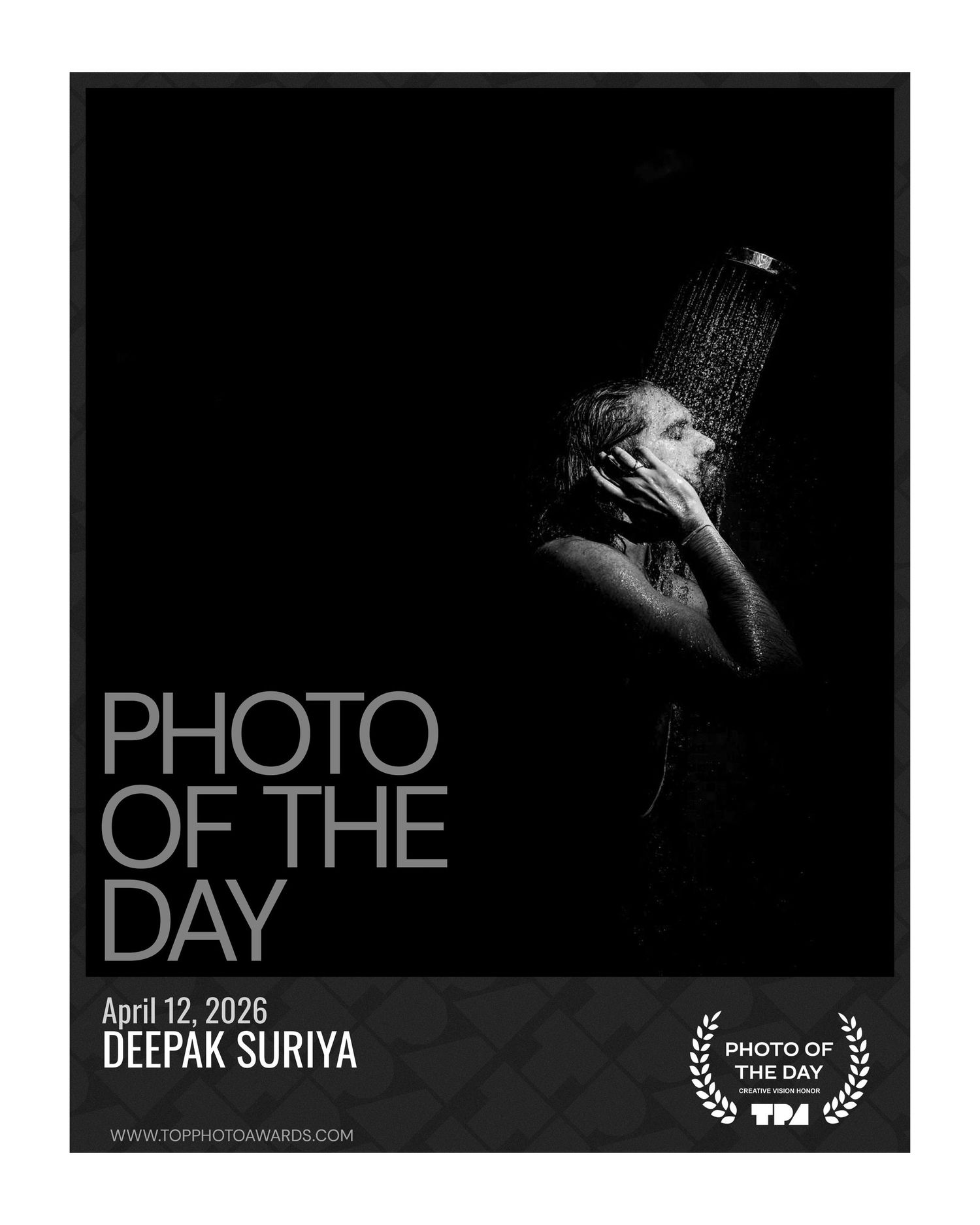 Black and white photo of a person showering, TPA Photo of the Day award by Deepak Suriya, April 2026.