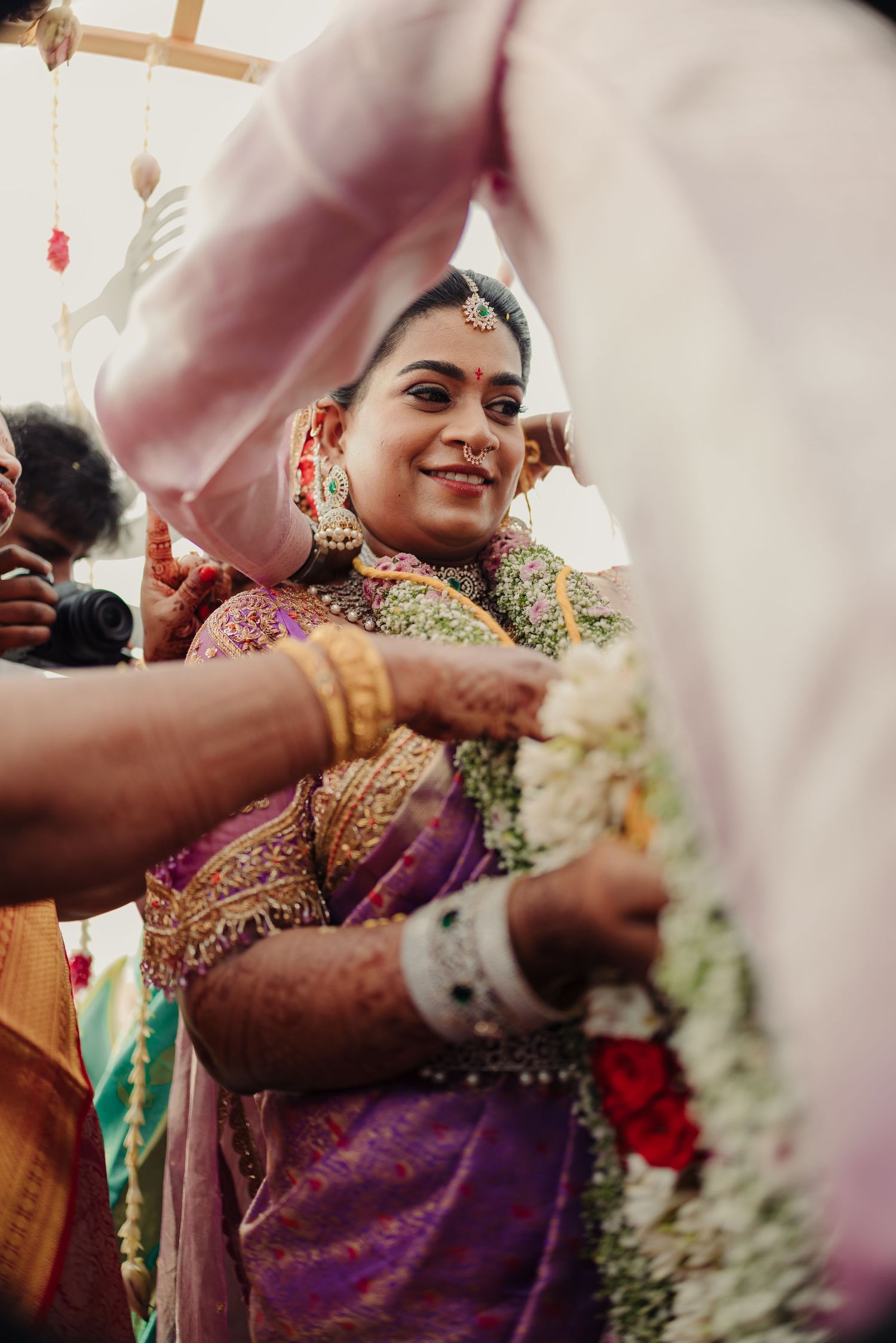 Traditional Indian wedding ceremony with guests participating in cultural rituals and customs.