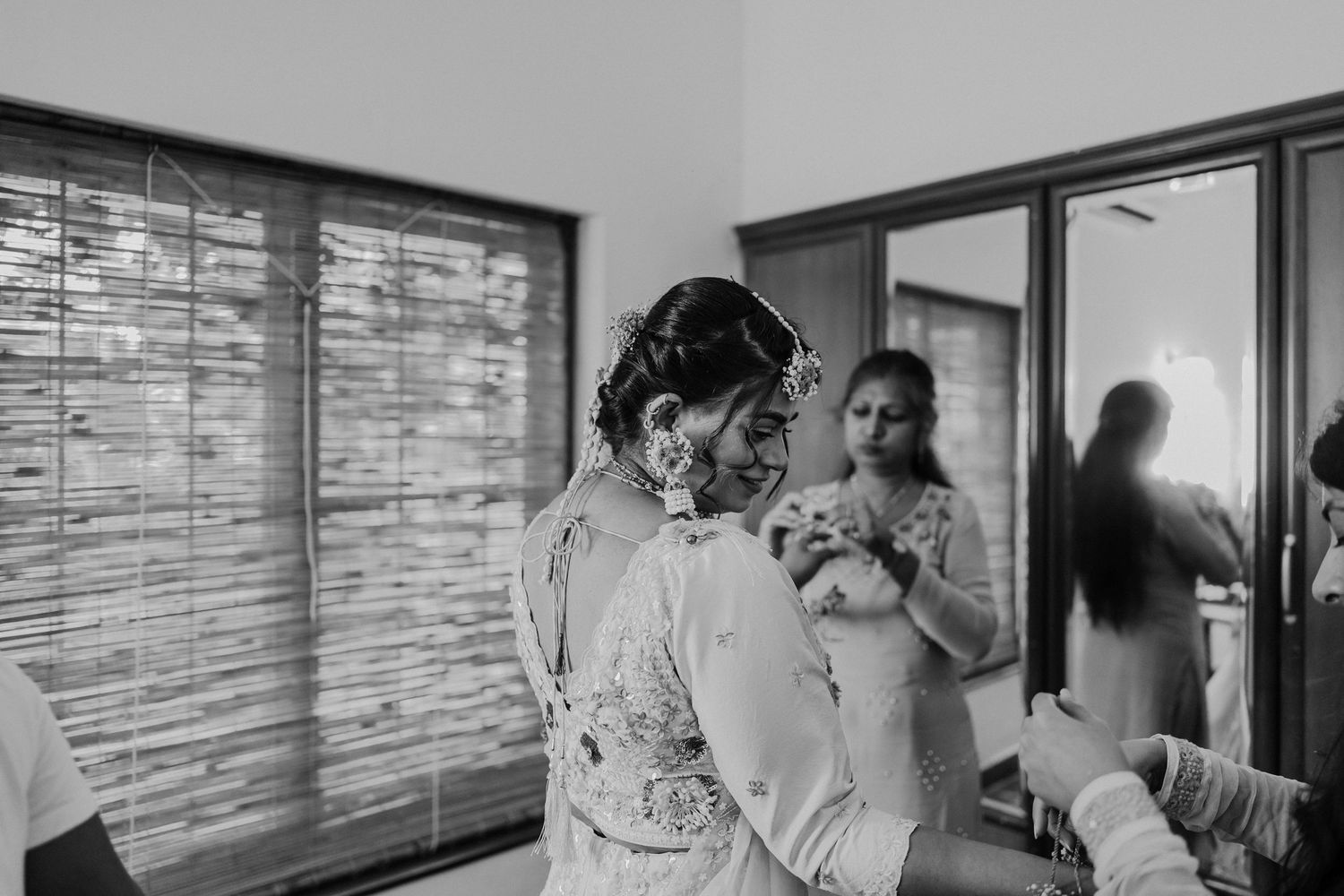 A series of black and white photos showing people in a medical setting performing various healthcare procedures.