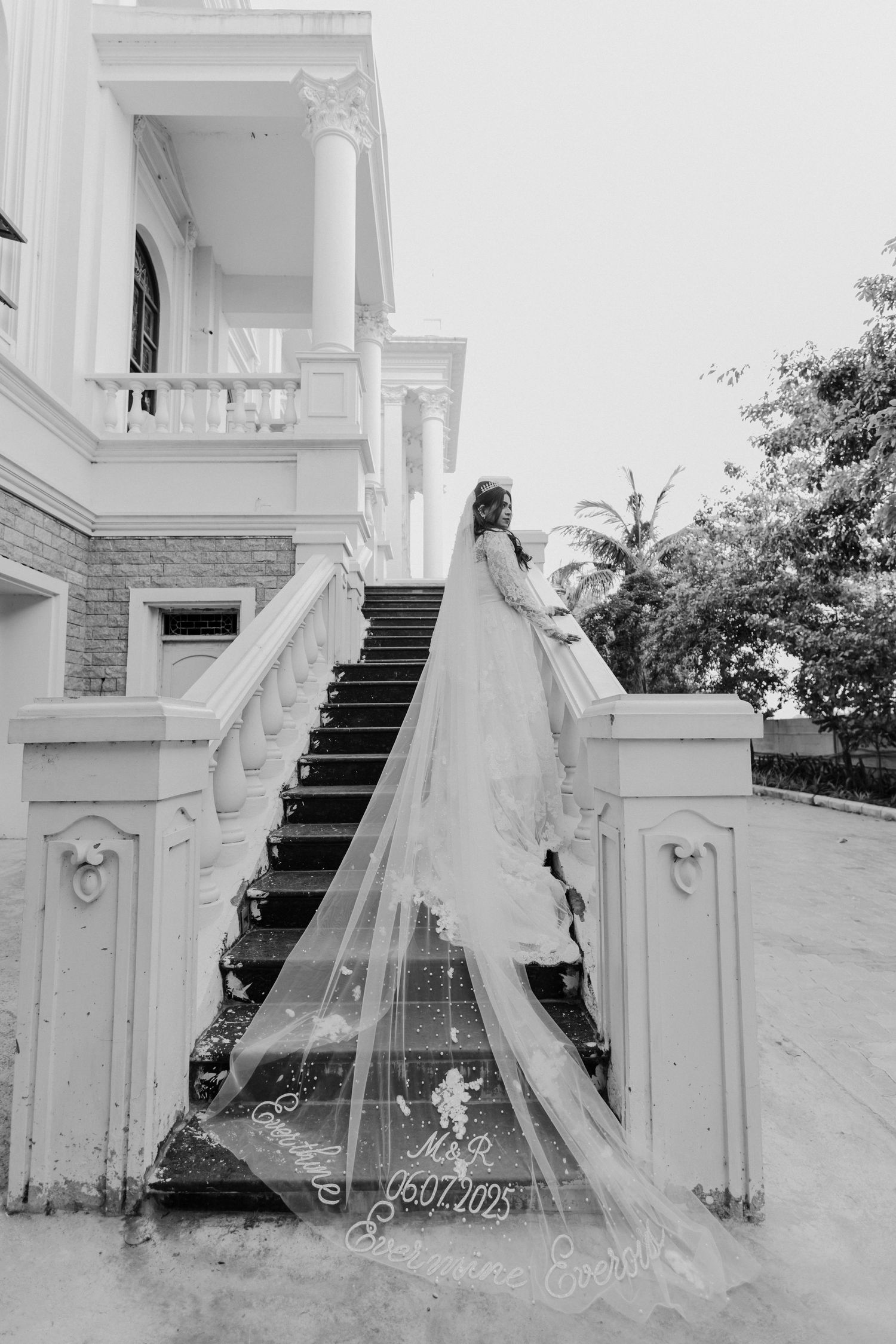 Ethereal bridal portraits captured in sequence on an elegant white staircase with flowing veil.
