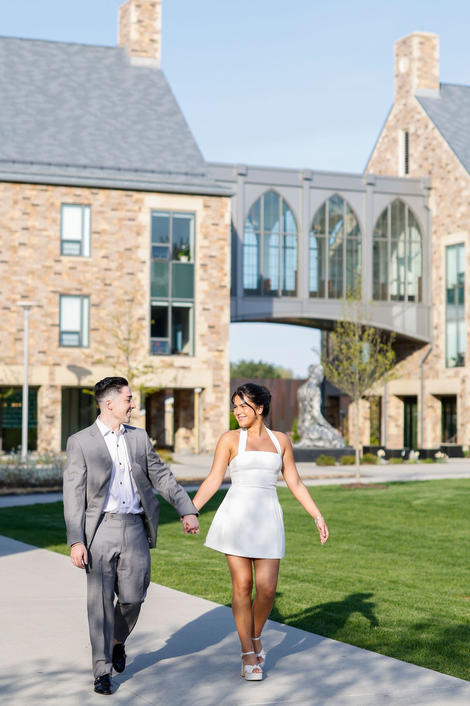 Couple walking on Sacred Heart University Campus