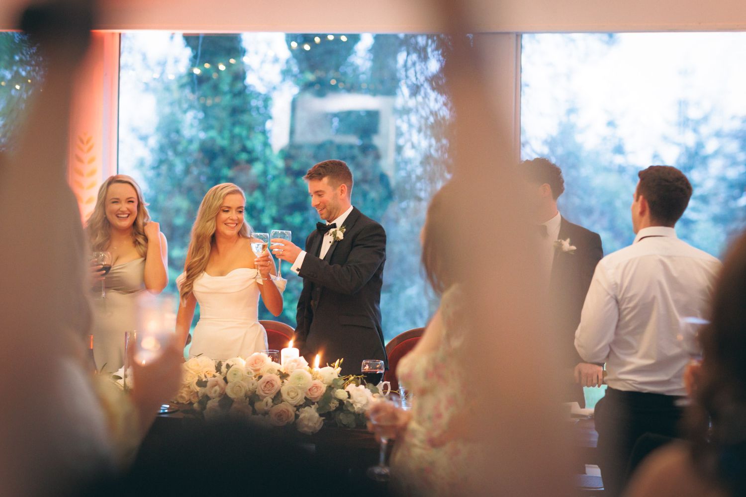 Bride and groom toasting at wedding reception.