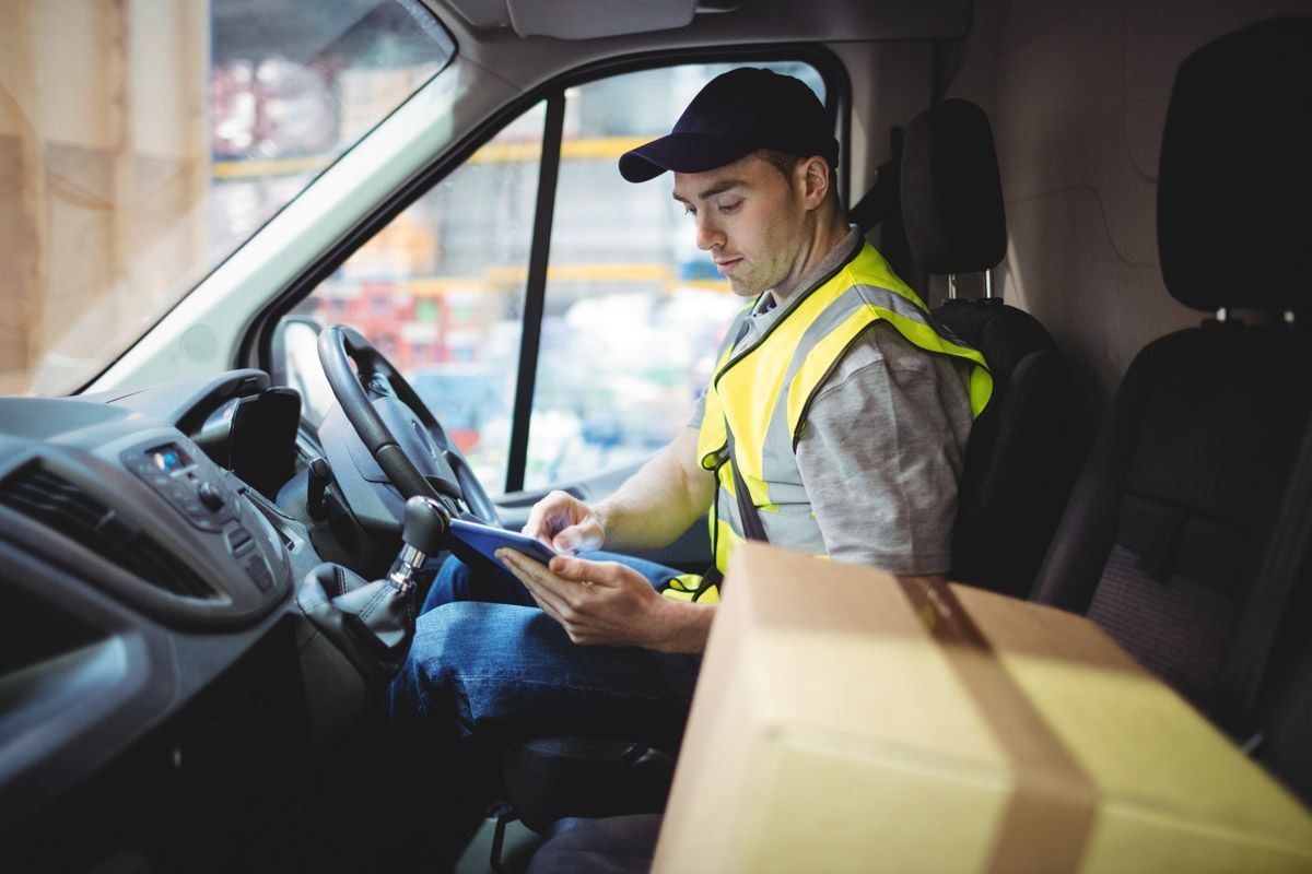 Professional delivery worker preparing for route.