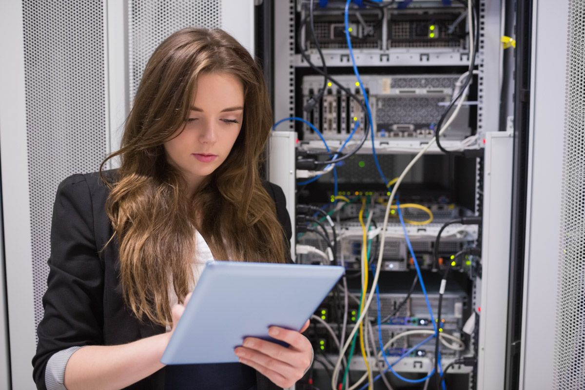 Engineer performing maintenance on network equipment.