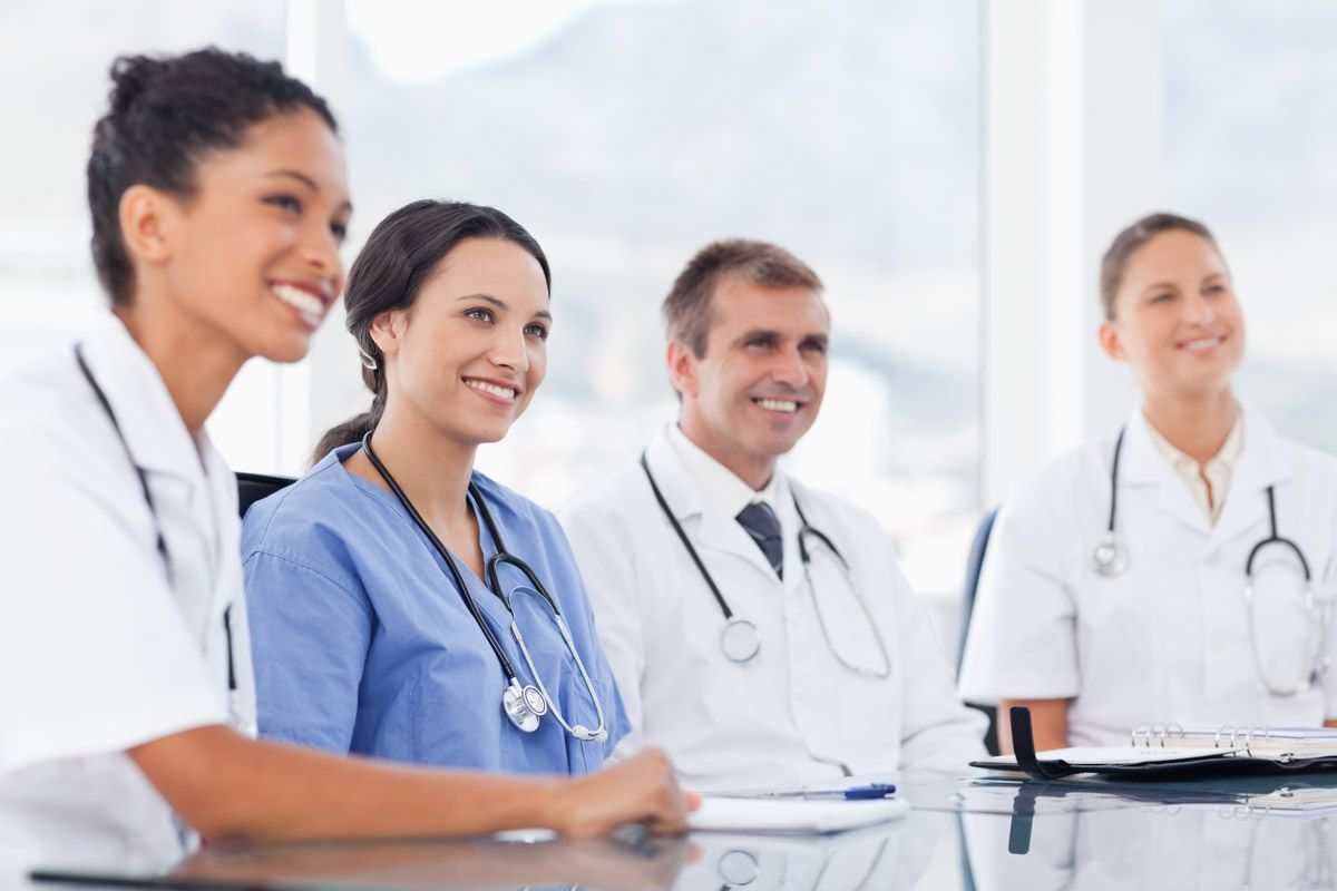 Medical team portrait in professional environment.