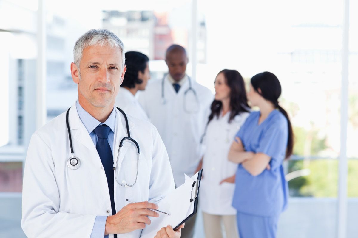 Medical professional smiling in workplace portrait.