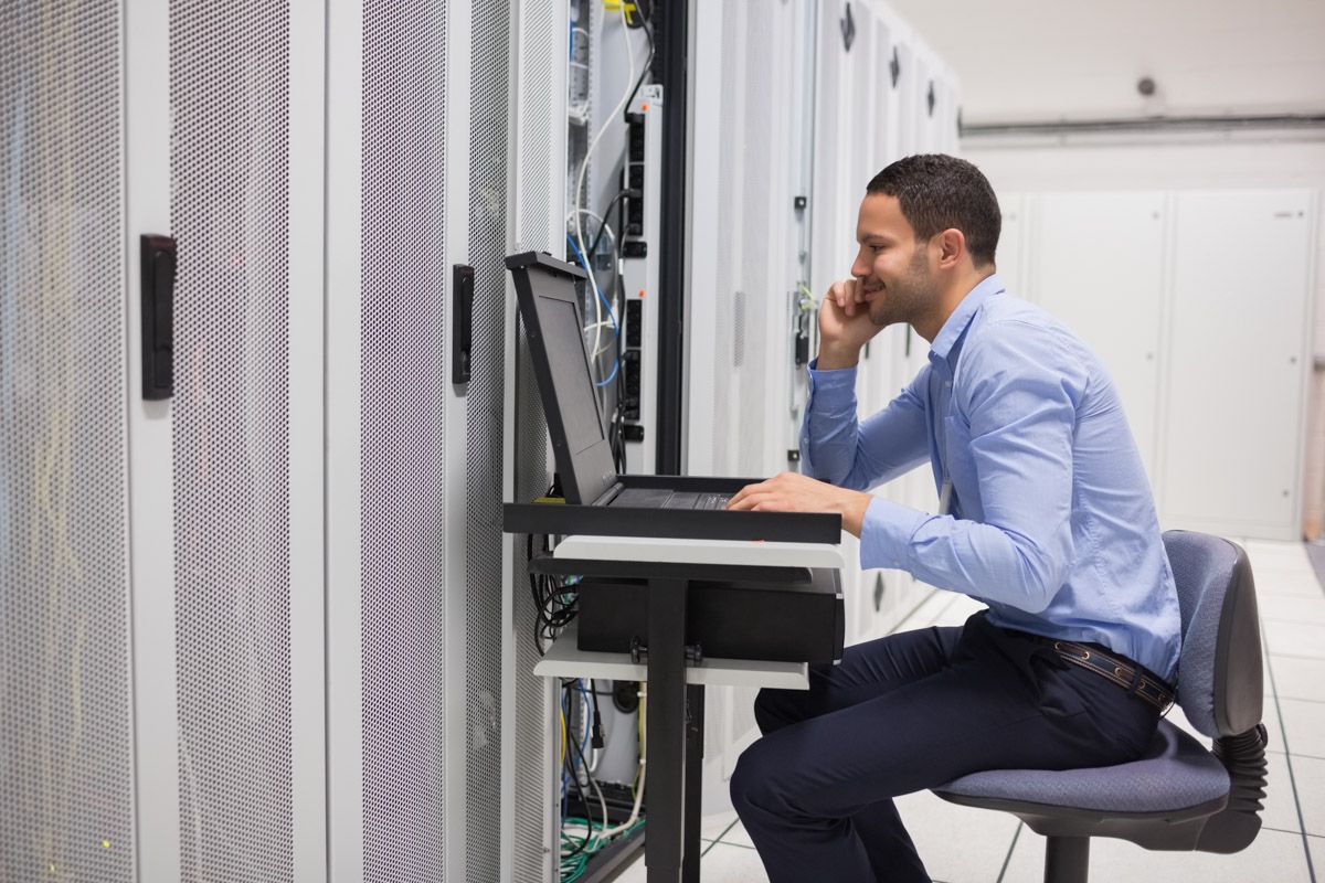 Professional managing infrastructure in modern data centre.