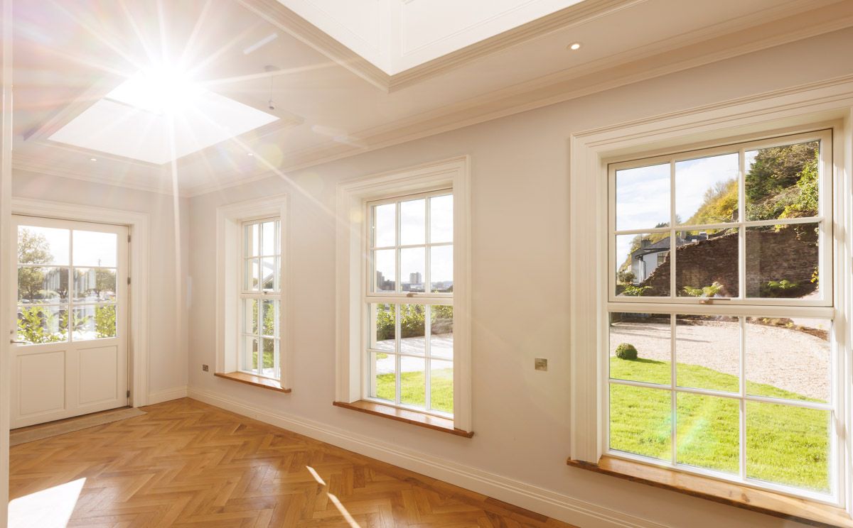 Architectural details of windows and doors with sunlight beaming through.