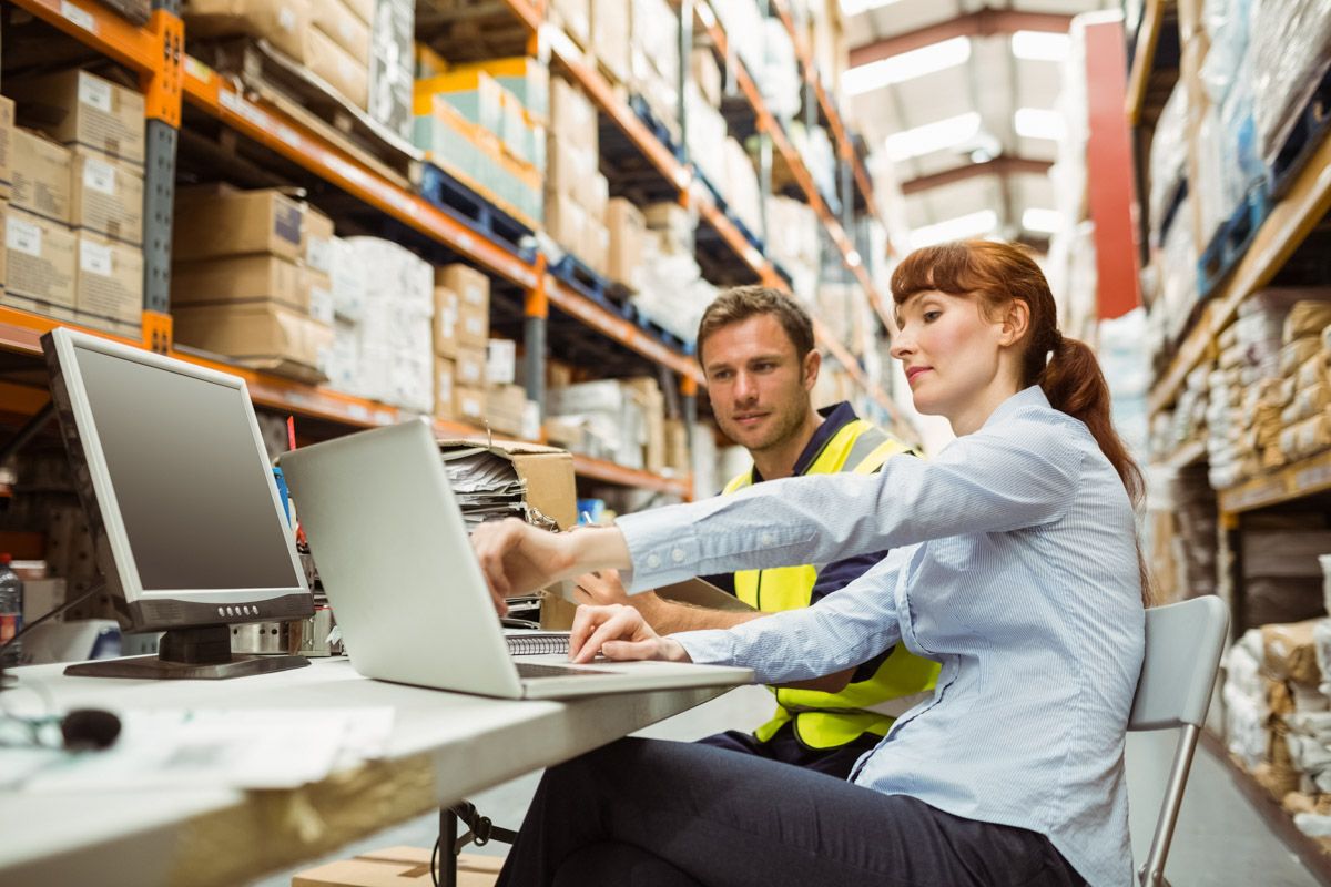 Group of warehouse workers organizing inventory in Cork.