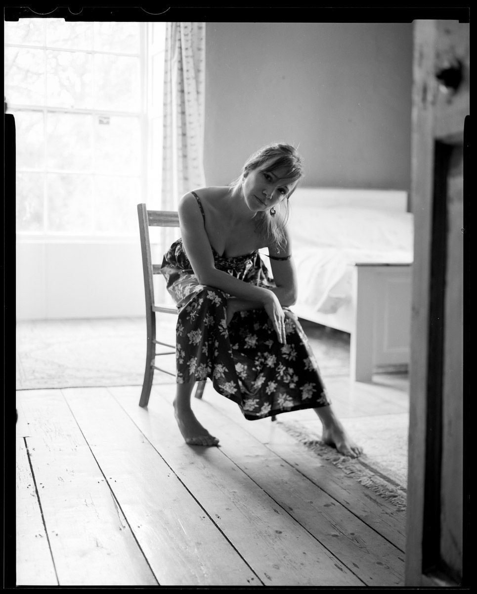 Indoor portrait with soft lighting on subject.