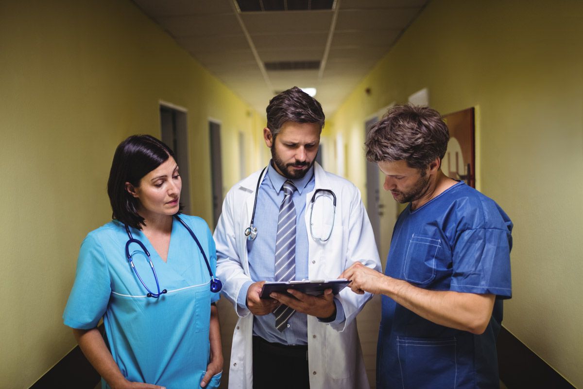 Professional photo of doctors reviewing medical documents in a hospital, captured by Cork commercial photographer Paul Cowhig
