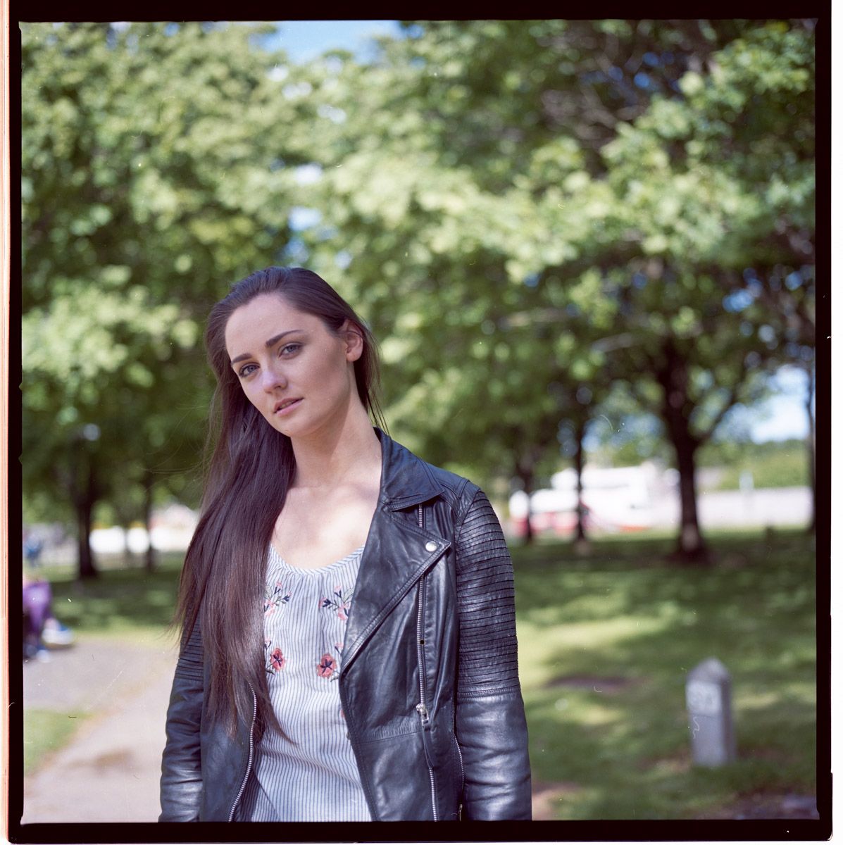 Outdoor portrait with warm sunlight.