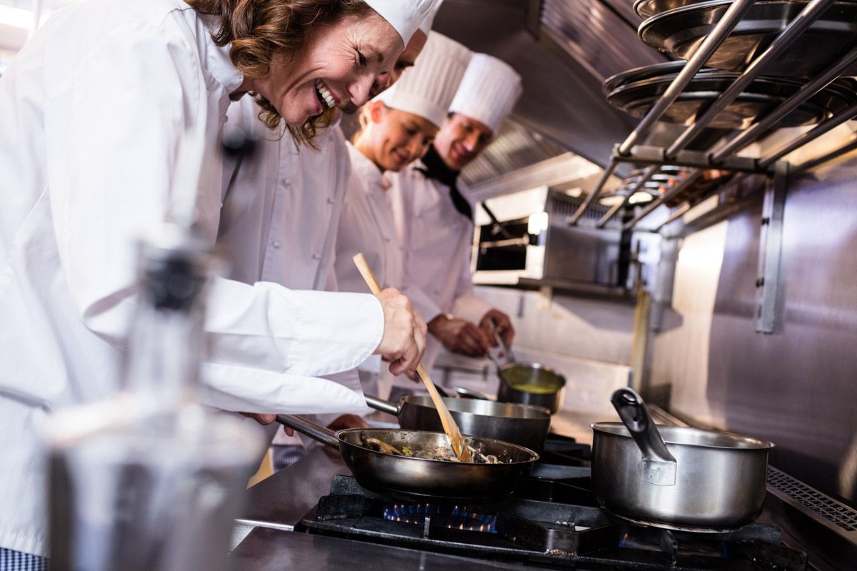 Culinary team preparing fine dining dishes.