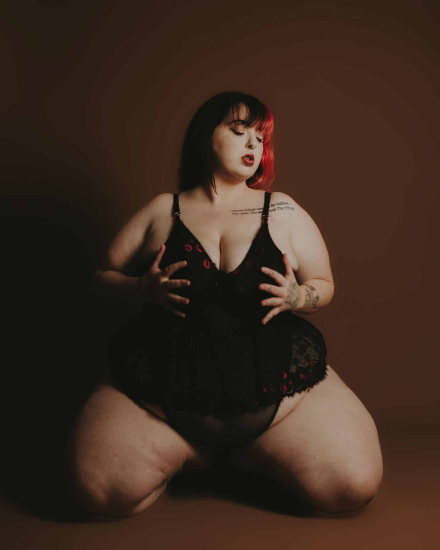 Artistic boudoir photo series featuring dramatic shadows and black lingerie against a dark brown background.
