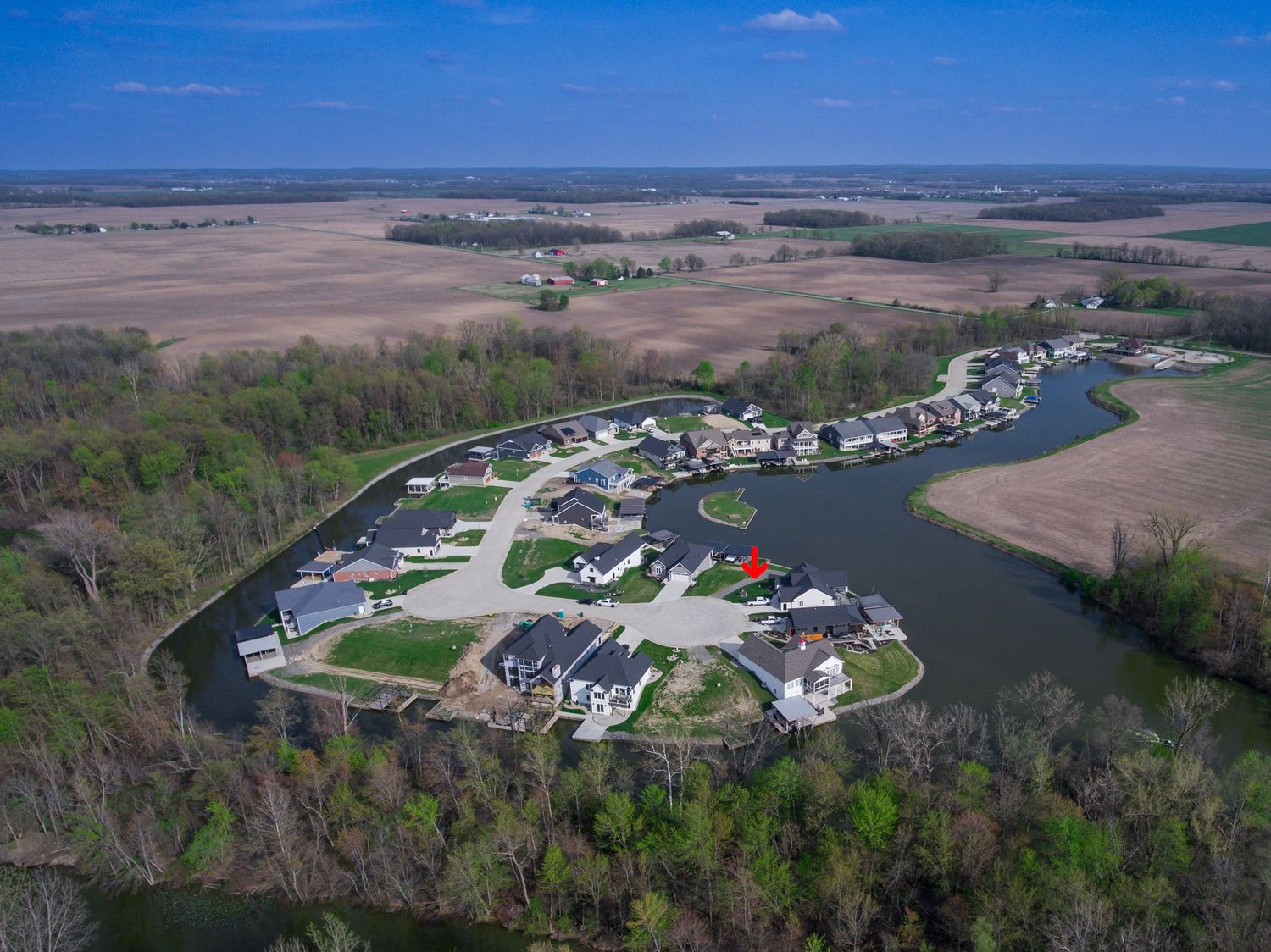 Drone photography of waterfront property with private shoreline and trees