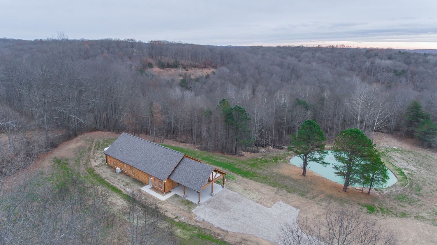 Aerial drone photo of cabin in Hocking Hills, Ohio surrounded by forest