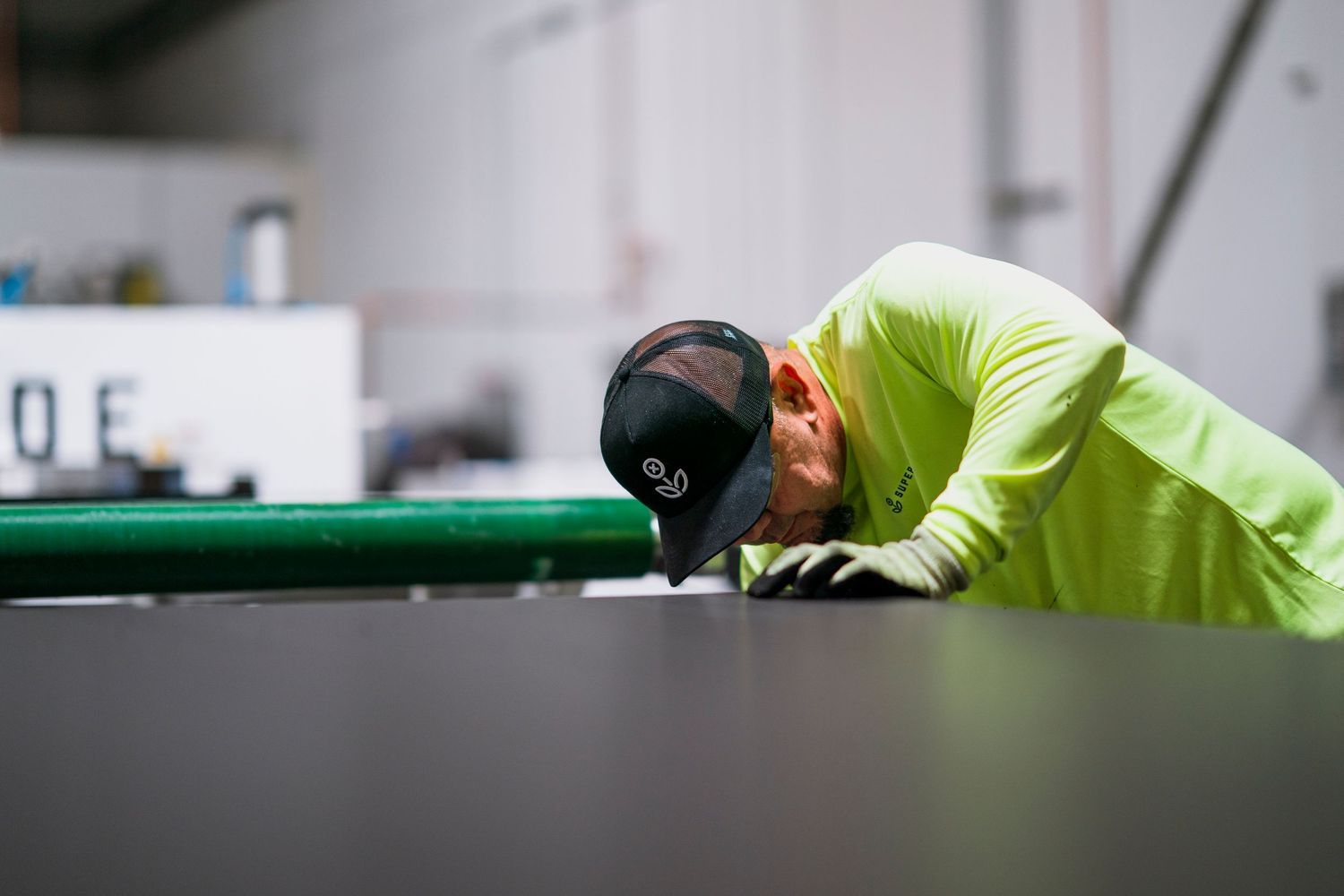 Quality control inspection of industrial equipment in manufacturing facility.