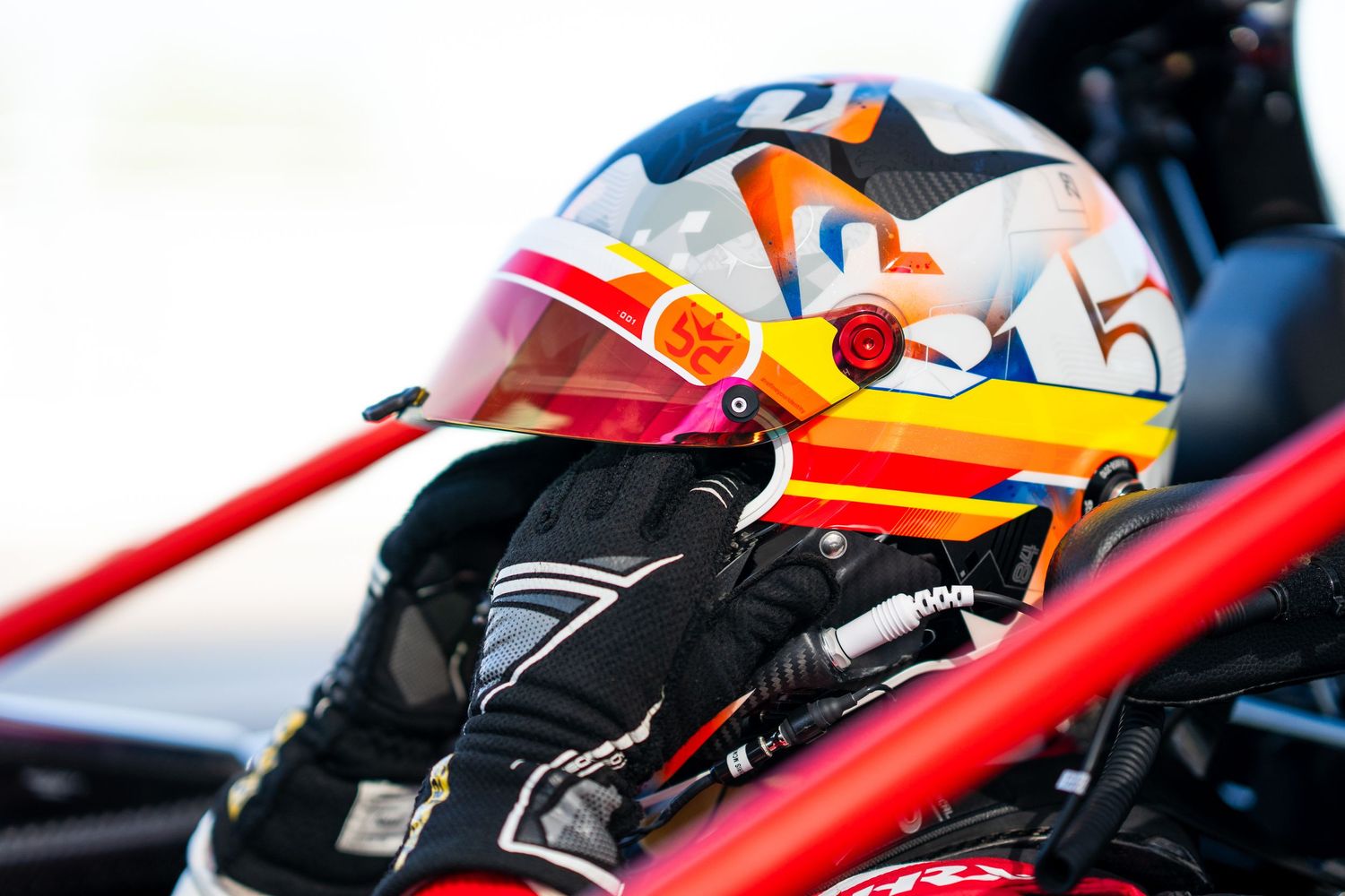 Close-up view of Formula 1 racing cars speeding along a racetrack with motion blur effects.