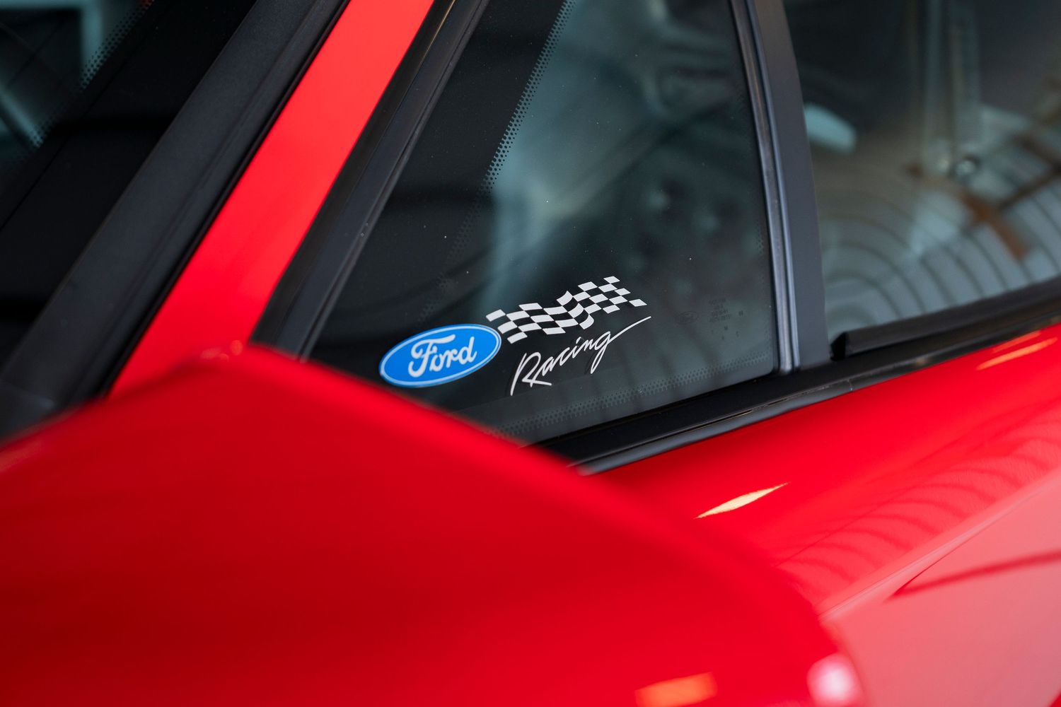 Row of detailed exterior shots showing red sports car design elements.