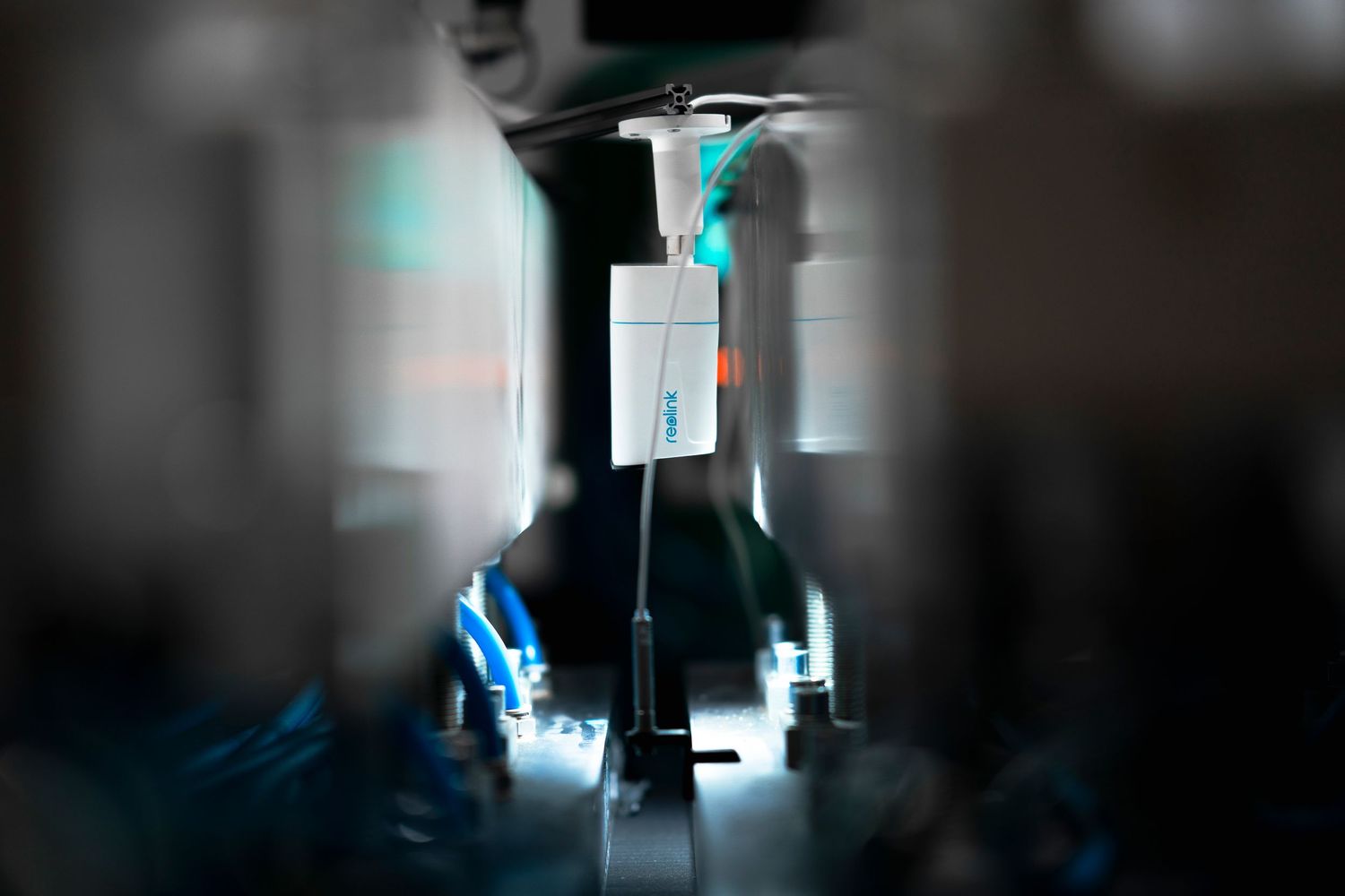 A medical IV drip bag and stand shown in a dark hospital room with blue tinted lighting effects.