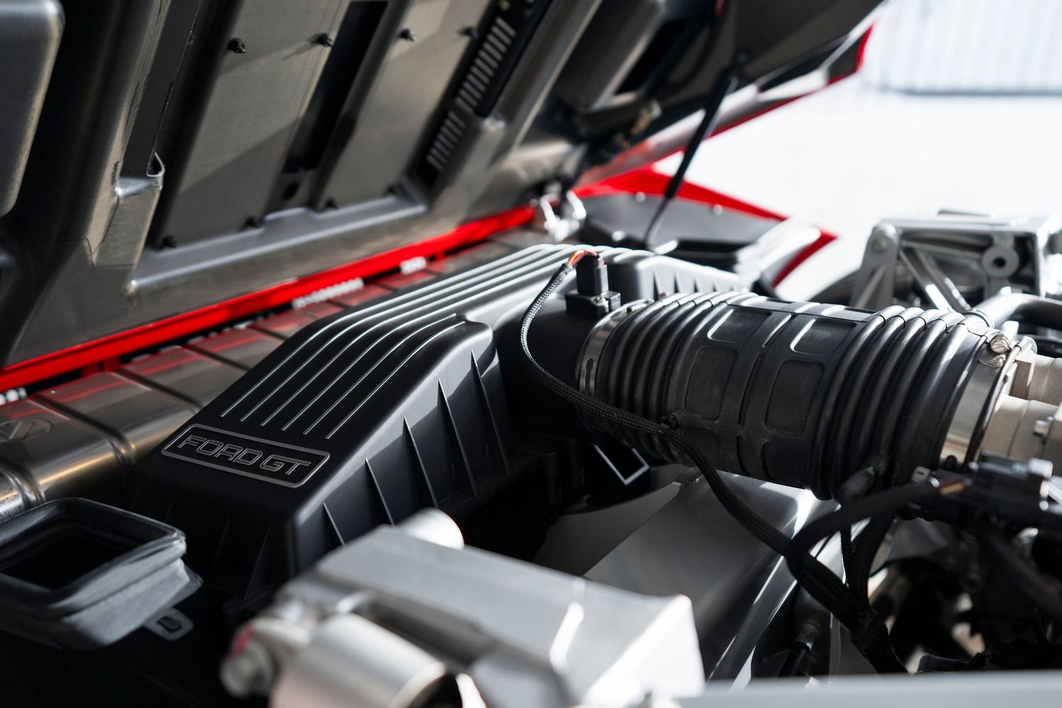Engine bay detail shots of high-performance vehicle components.