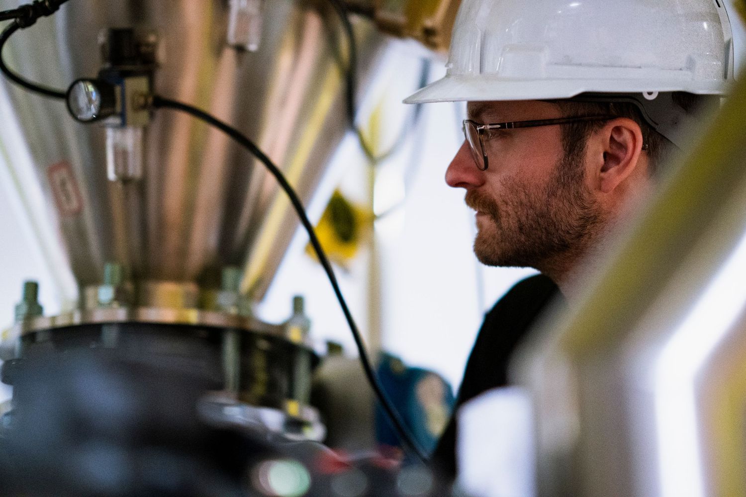 Close up detail of industrial manufacturing equipment and control interfaces.
