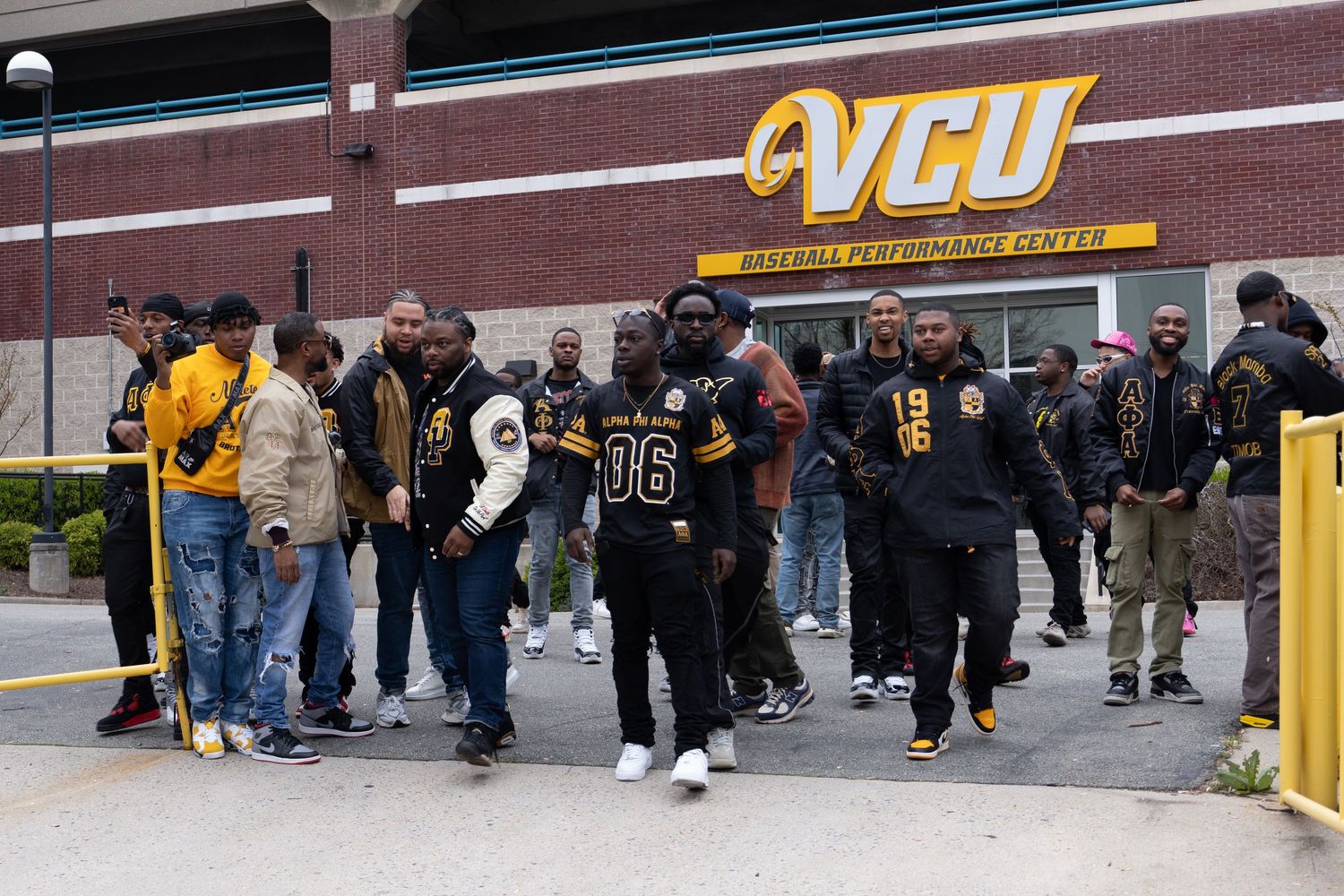 Long line of people waiting outside a retail store entrance.