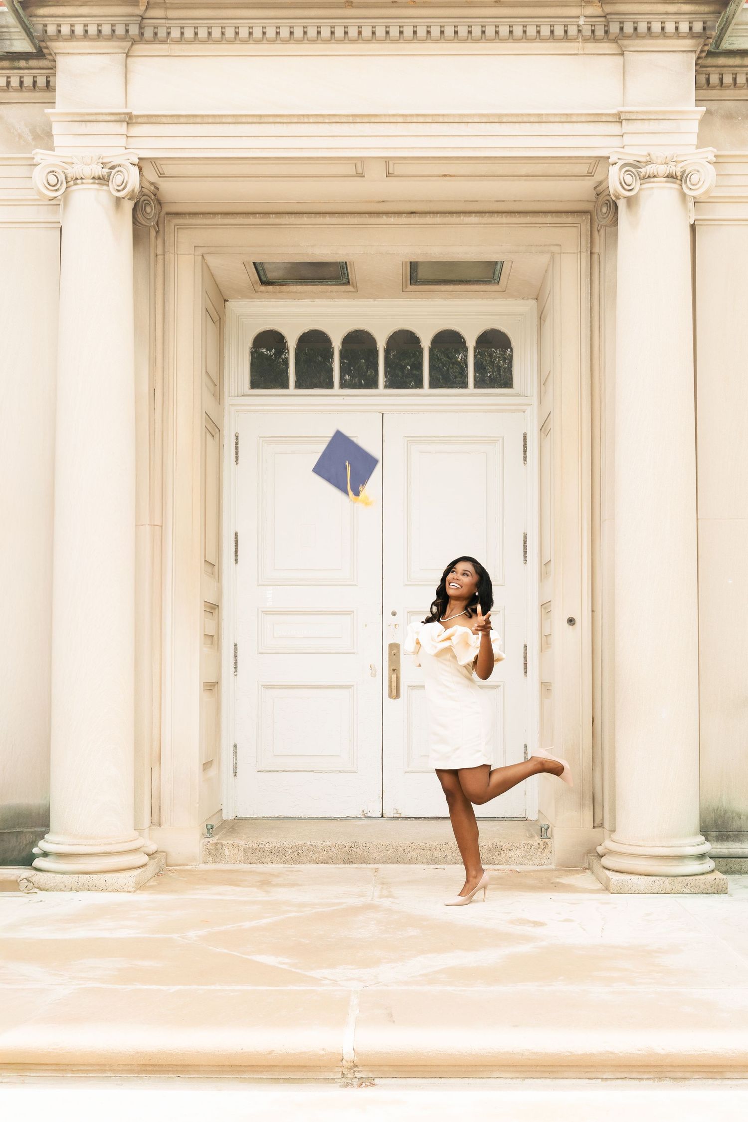 Three artistic dance photos show a graceful figure in motion against a classical white columned building backdrop.