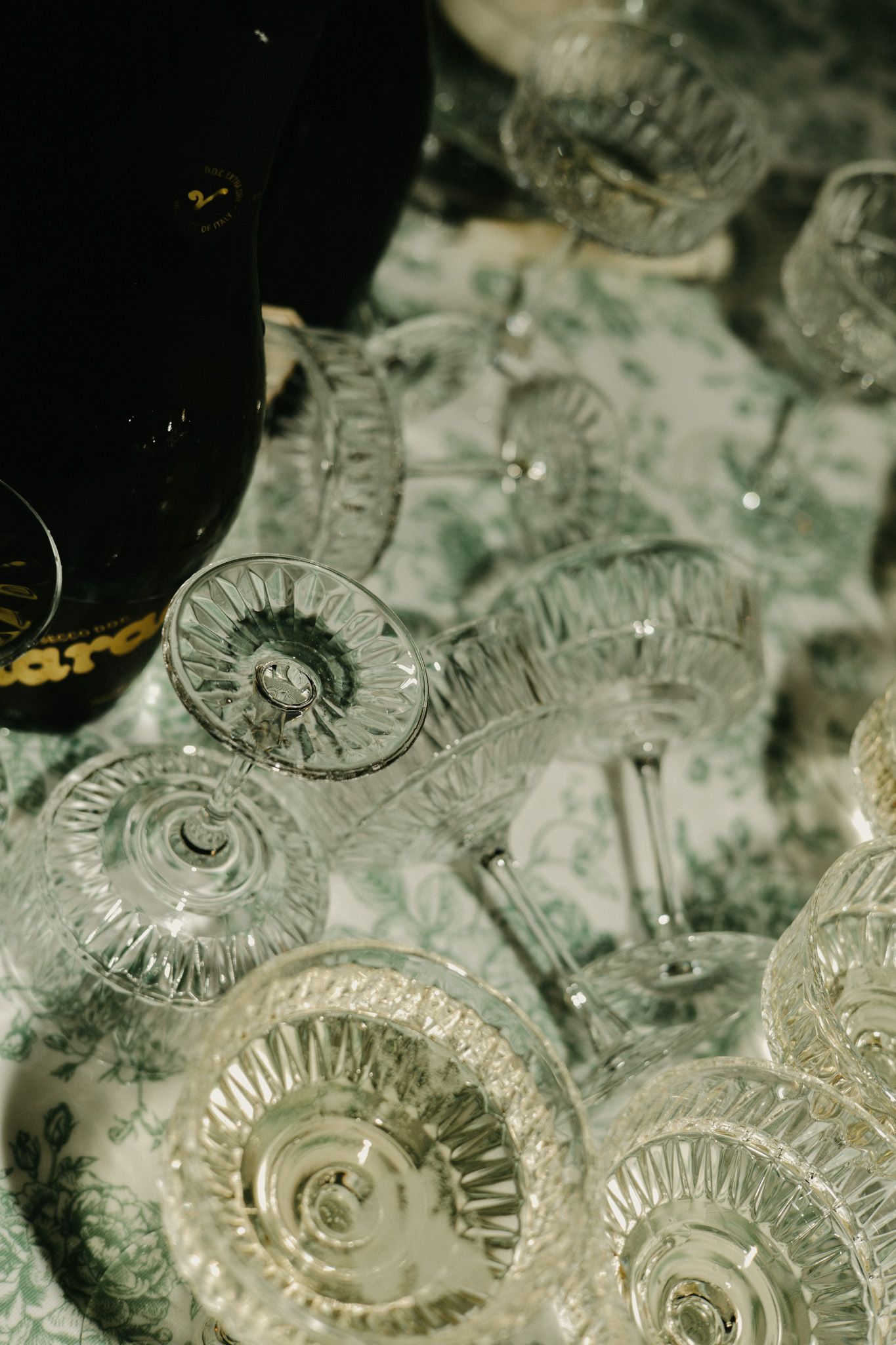 Crystal champagne glasses arranged in elegant detail for a celebration.