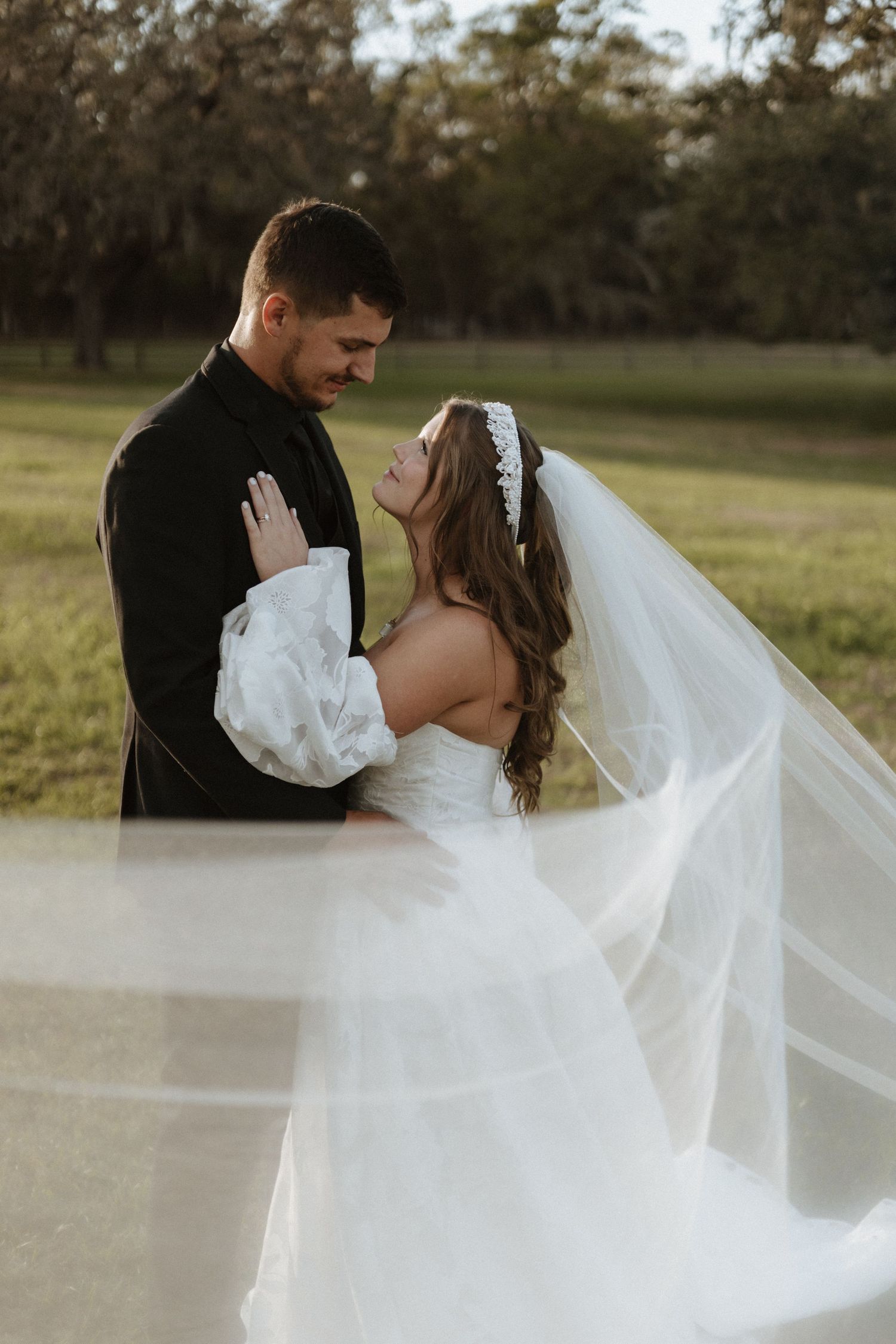 A romantic wedding portrait sequence showing a bride and groom with flowing veil.