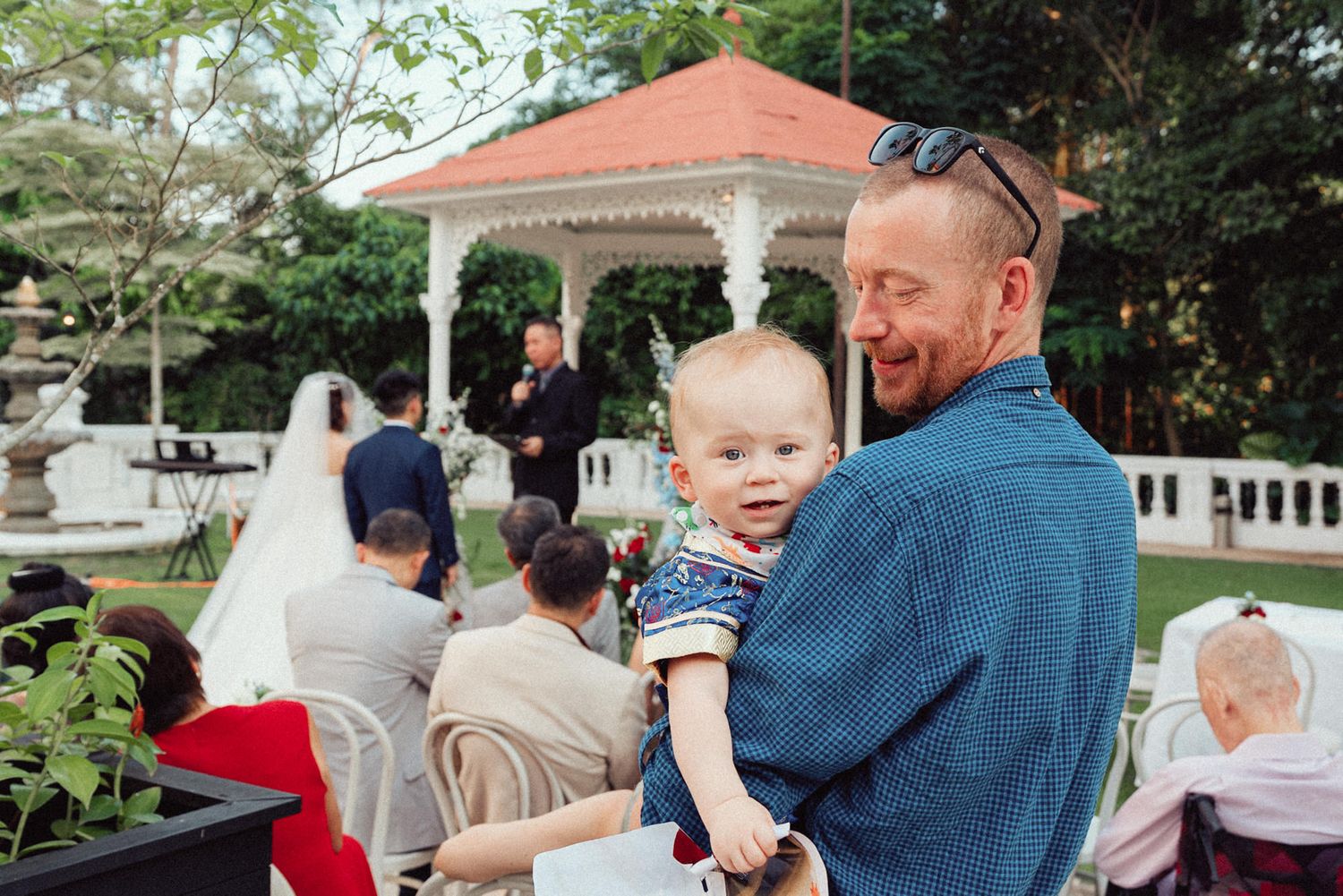 A collage of family moments showing people hugging and interacting outdoors in various settings.