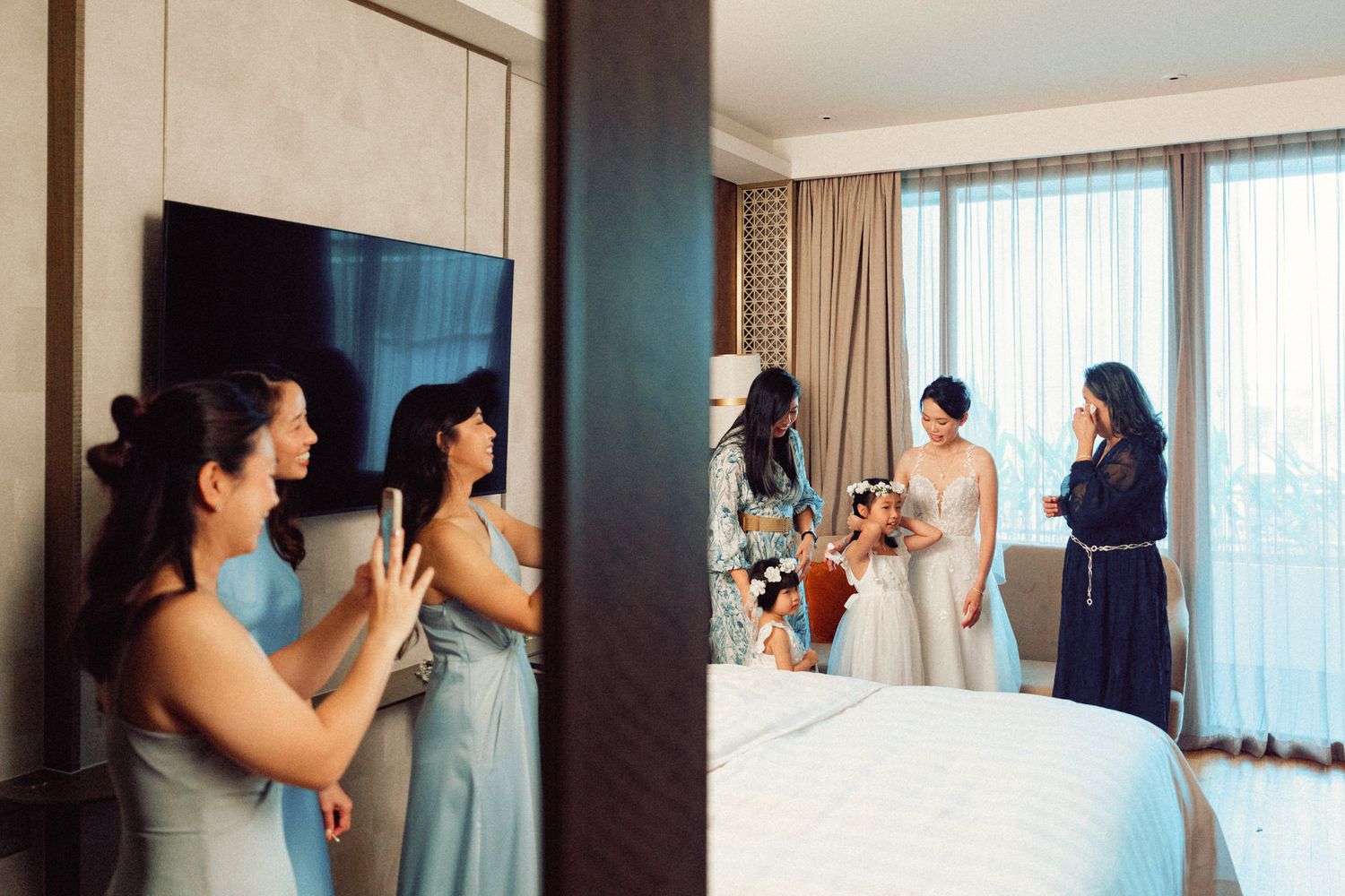 Interior of a luxurious hotel room with large windows and elegant furnishings during wedding preparations.