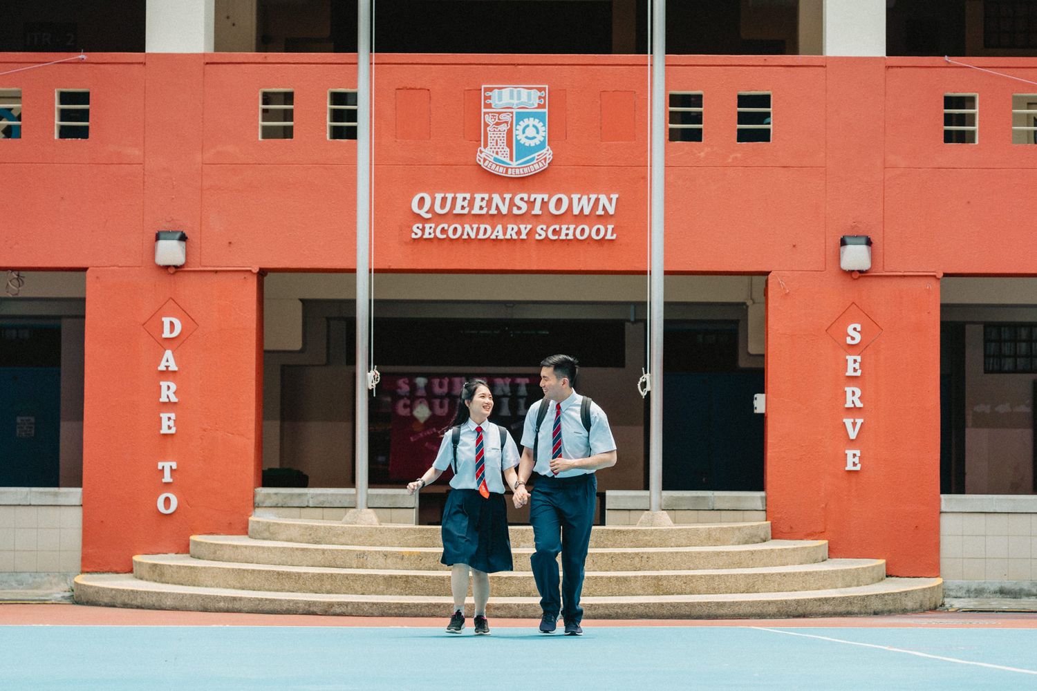 Exterior view of Queenstown Primary School building with its distinctive orange facade.