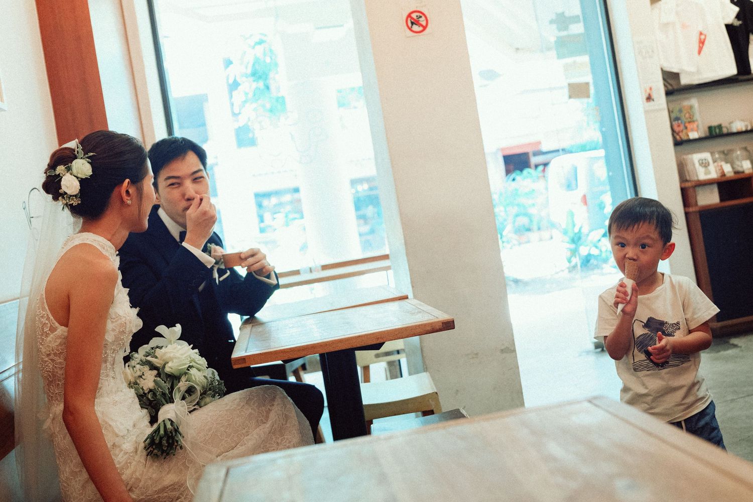 Wedding celebration candid moments captured at an indoor reception venue.