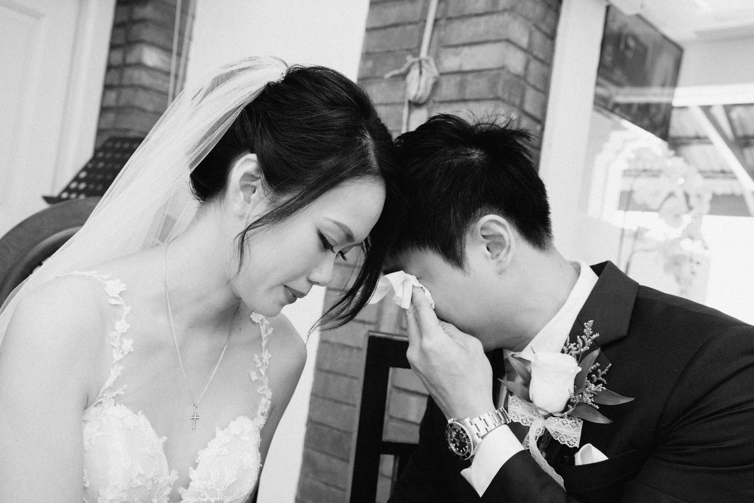 Black and white photos capturing intimate moments during wedding ceremony.