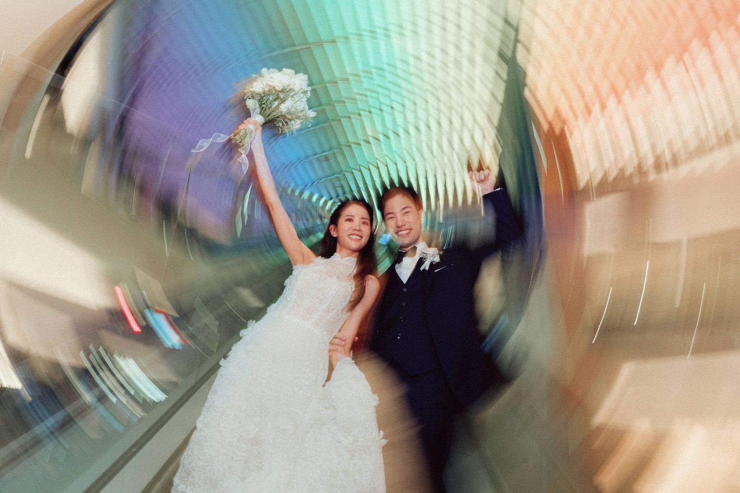 Abstract motion blur wedding photography with artistic swirls of color and movement.