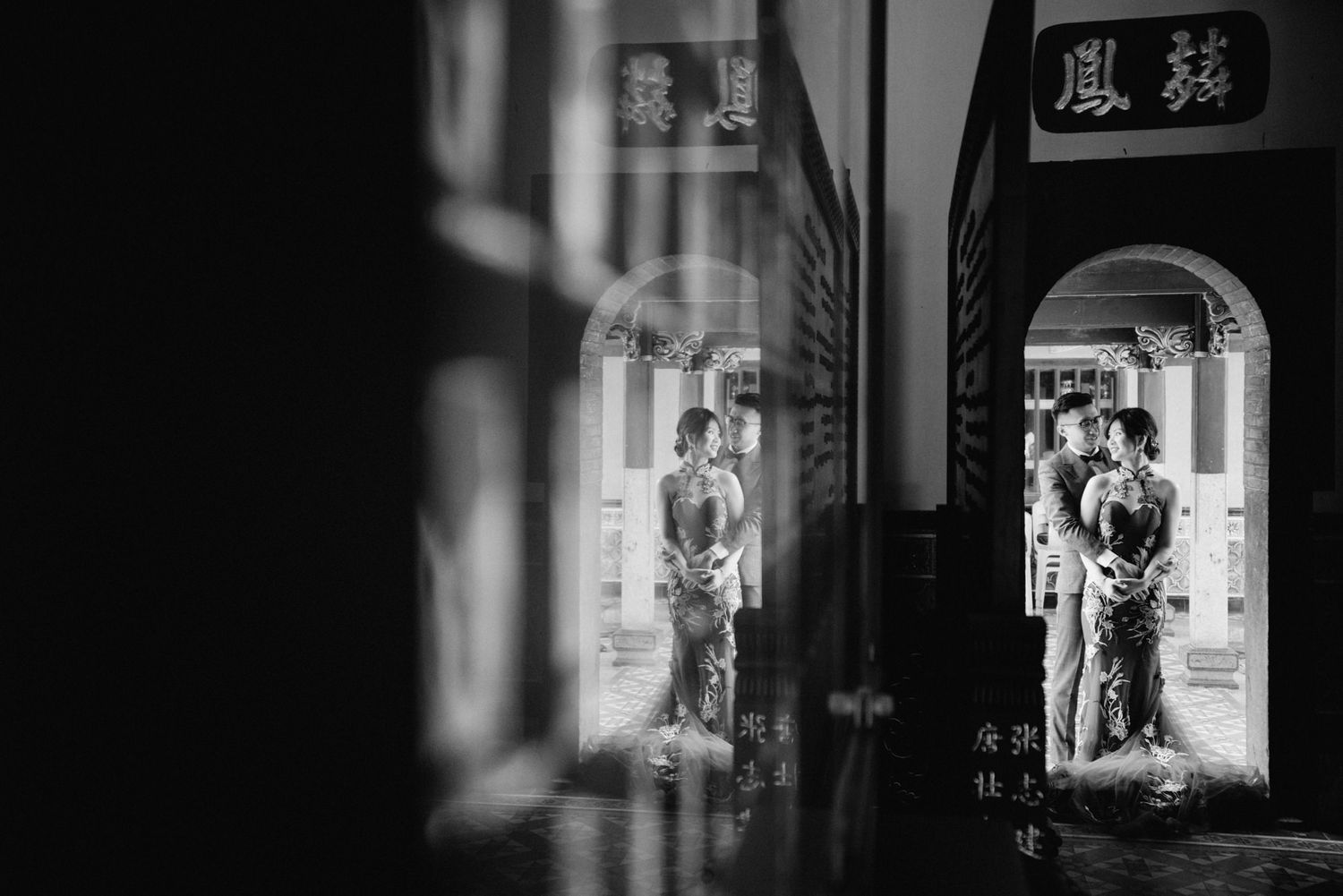 Black and white artistic view through temple doorways and corridors.