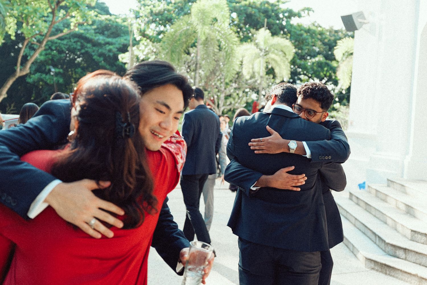 A series of emotional hugging moments captured at different angles outdoors and indoors.