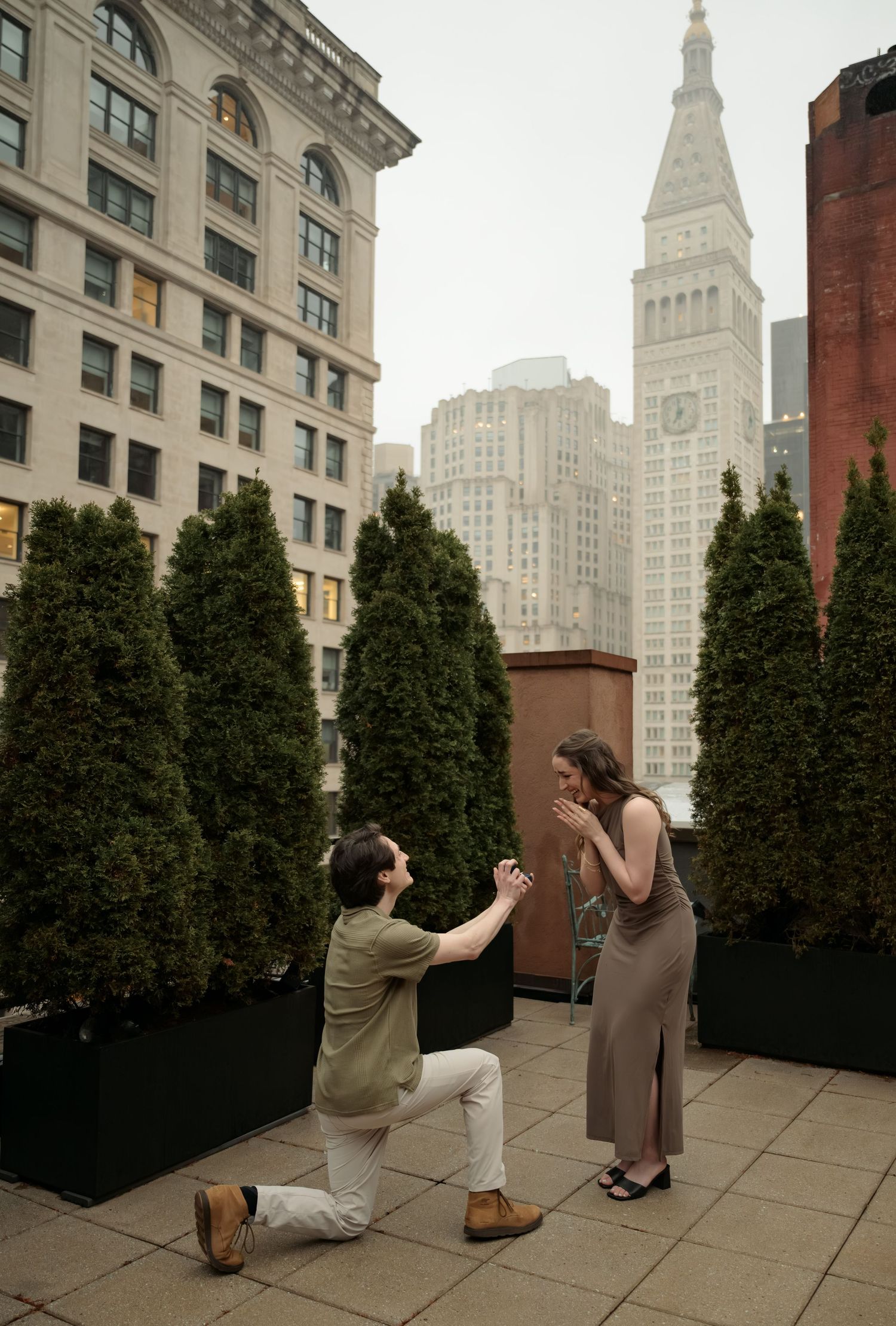 Series of lovers proposing in an urban rooftop garden with New York City architecture in background.