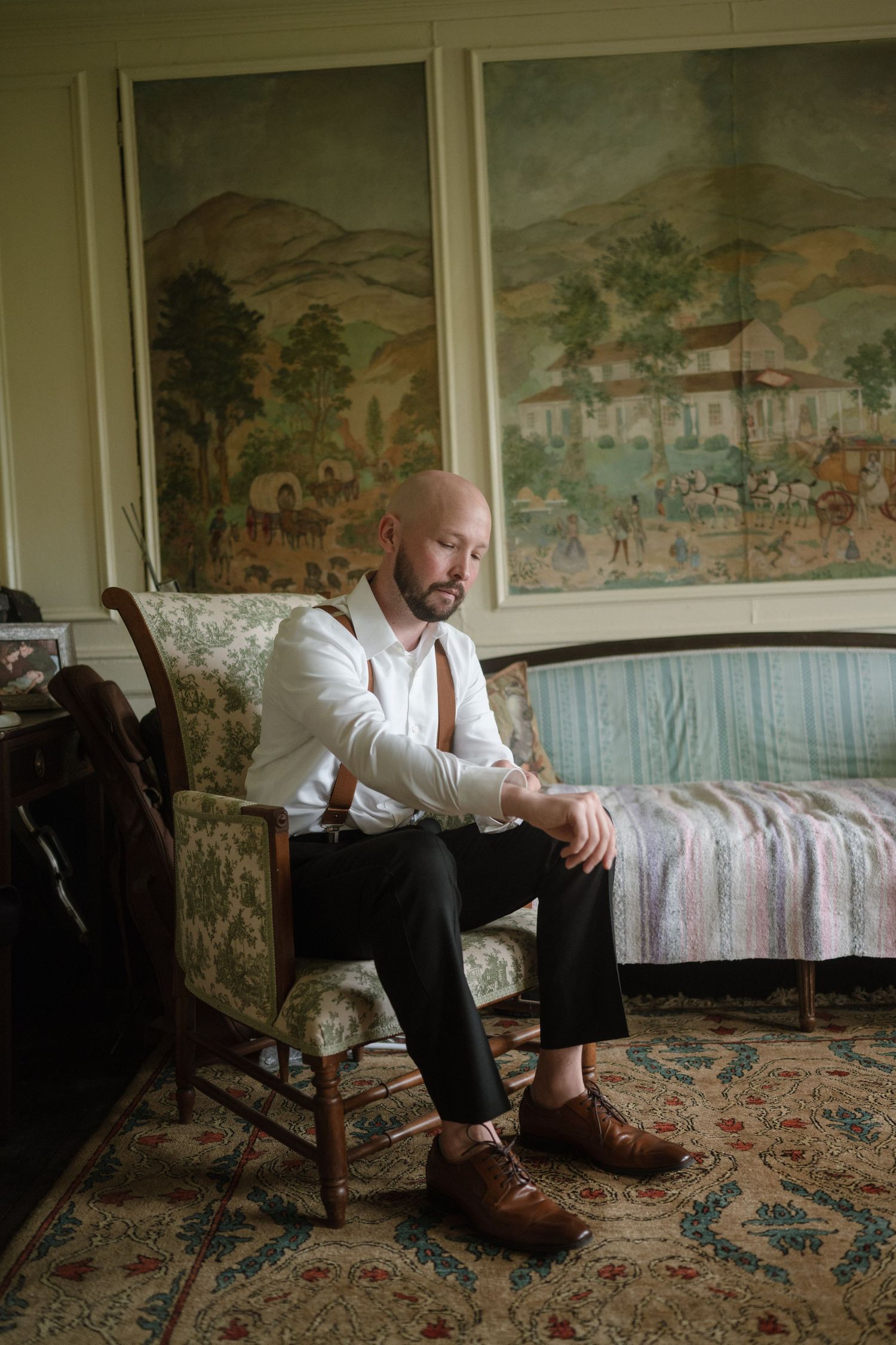 A series of artistic shots showing a person in a white shirt sitting in an ornate room with vintage wallpaper.