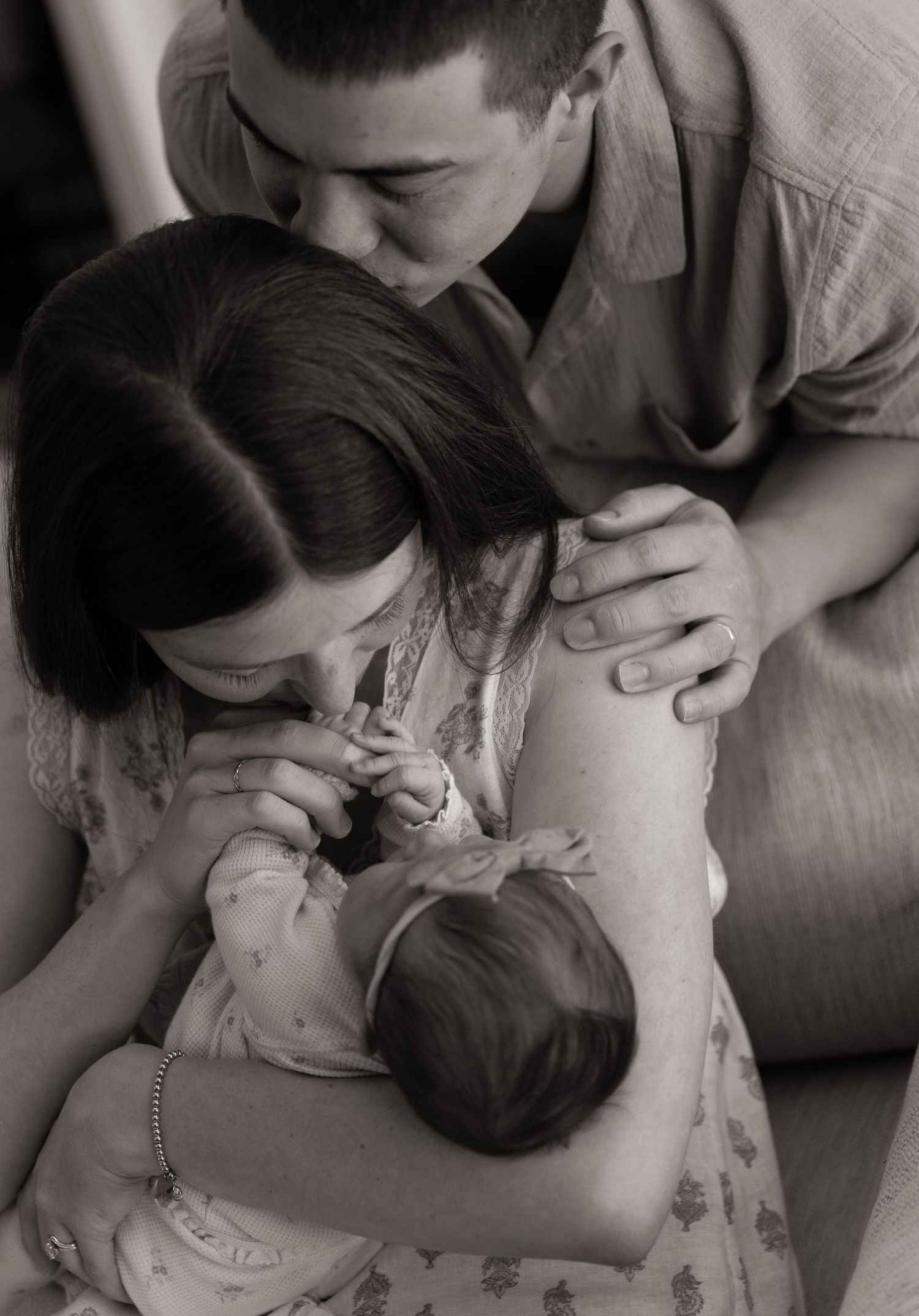 Intimate black and white family moment captured in a series of tender photographs.