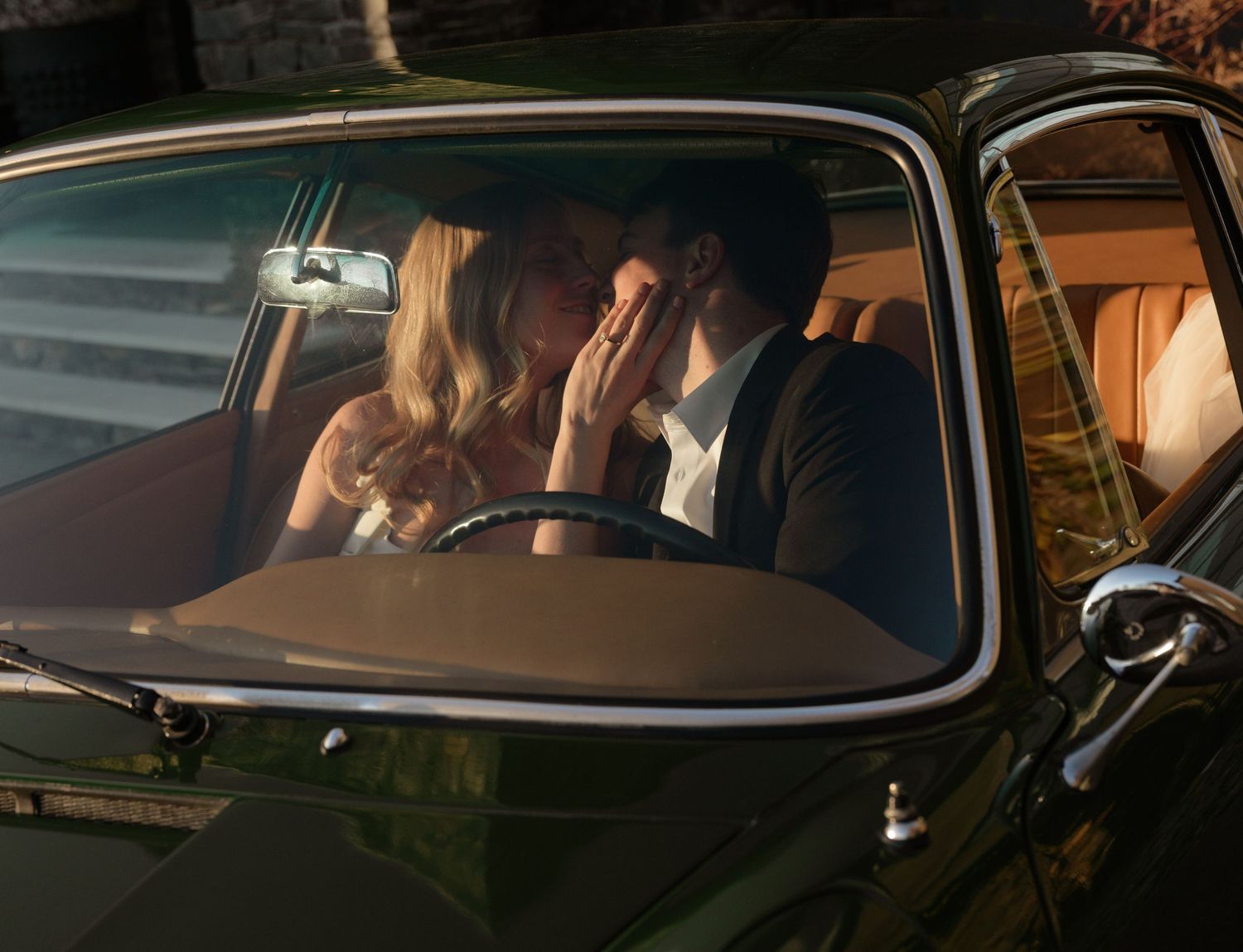 Vintage car silhouette with romantic sunset lighting through windows.