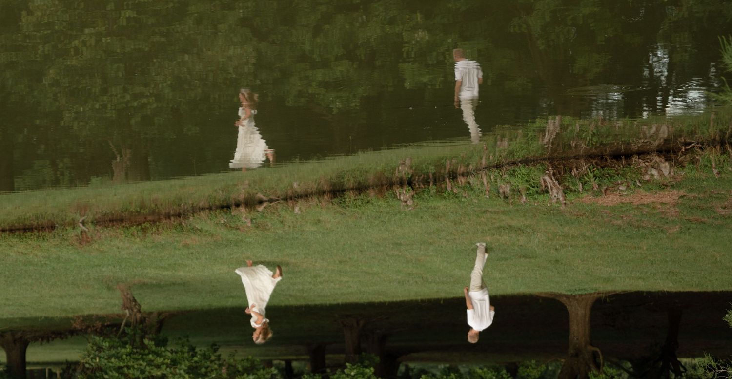 Rolling green hills and landscaped grounds of an elegant outdoor wedding venue.
